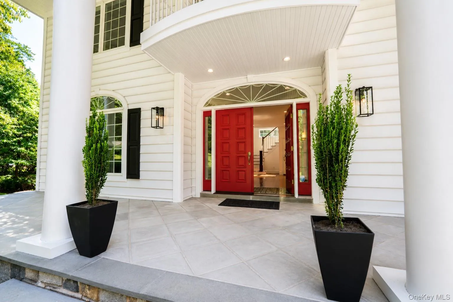 From the moment you arrive, Stonecrest Estate makes a lasting impression. Soaring architectural columns, an expansive bluestone front patio, and striking red double entry doors create a grand yet welcoming arrival that sets the tone for the exceptional home within. From the moment you arrive, Stonecrest Estate makes a lasting impression. Soaring architectural columns, an expansive bluestone front patio, and striking red double entry doors create a grand yet welcoming arrival that sets the tone for the exceptional home within.