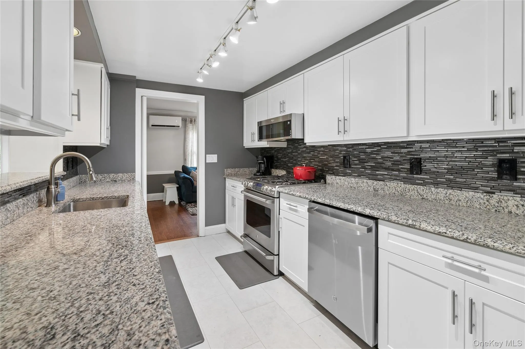 Updated Galley kitchen with view to adjacent family room Updated Galley kitchen with view to adjacent family room