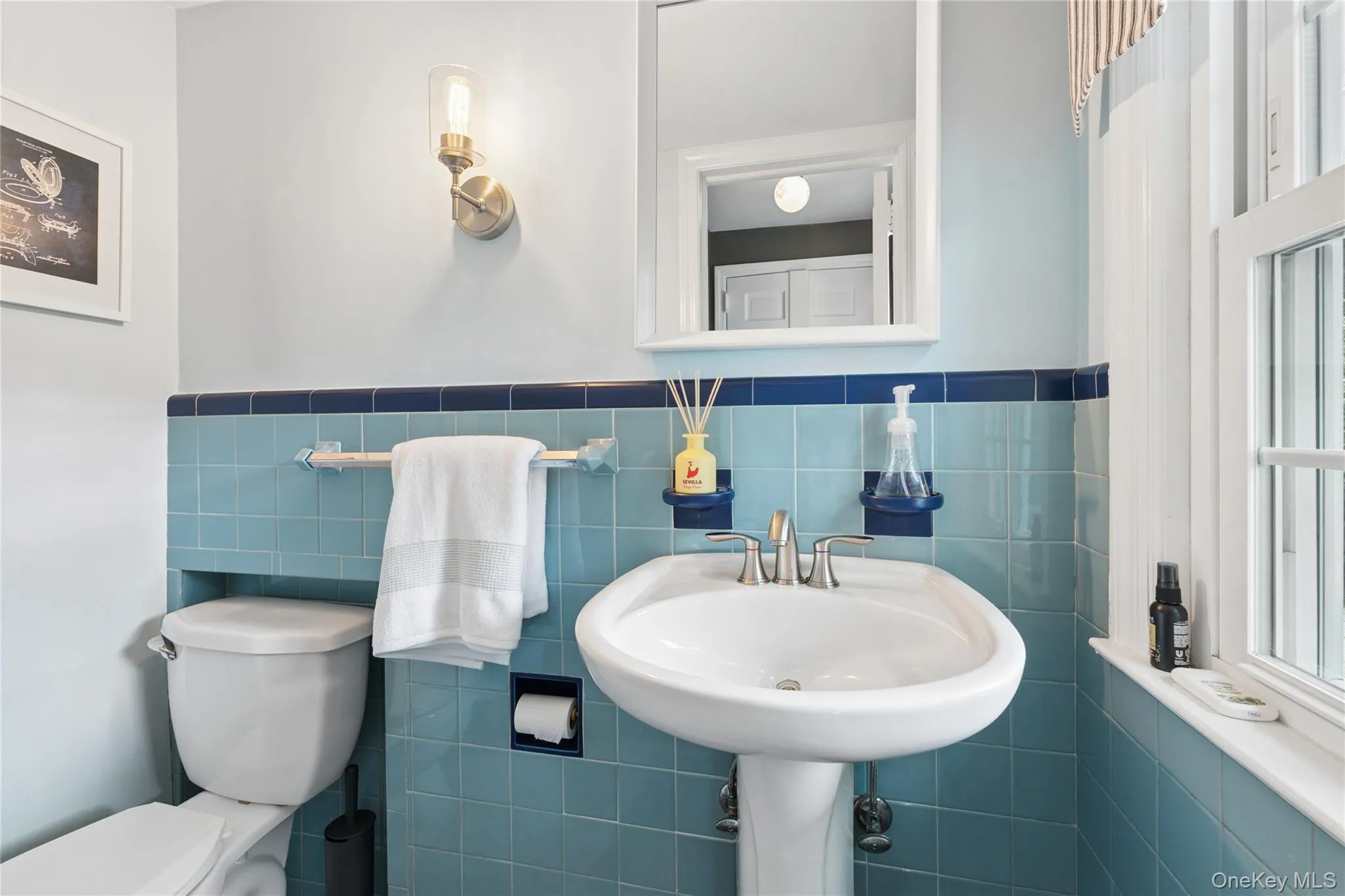 Perfectly located Half bath off the kitchen and back door to the patio Perfectly located Half bath off the kitchen and back door to the patio