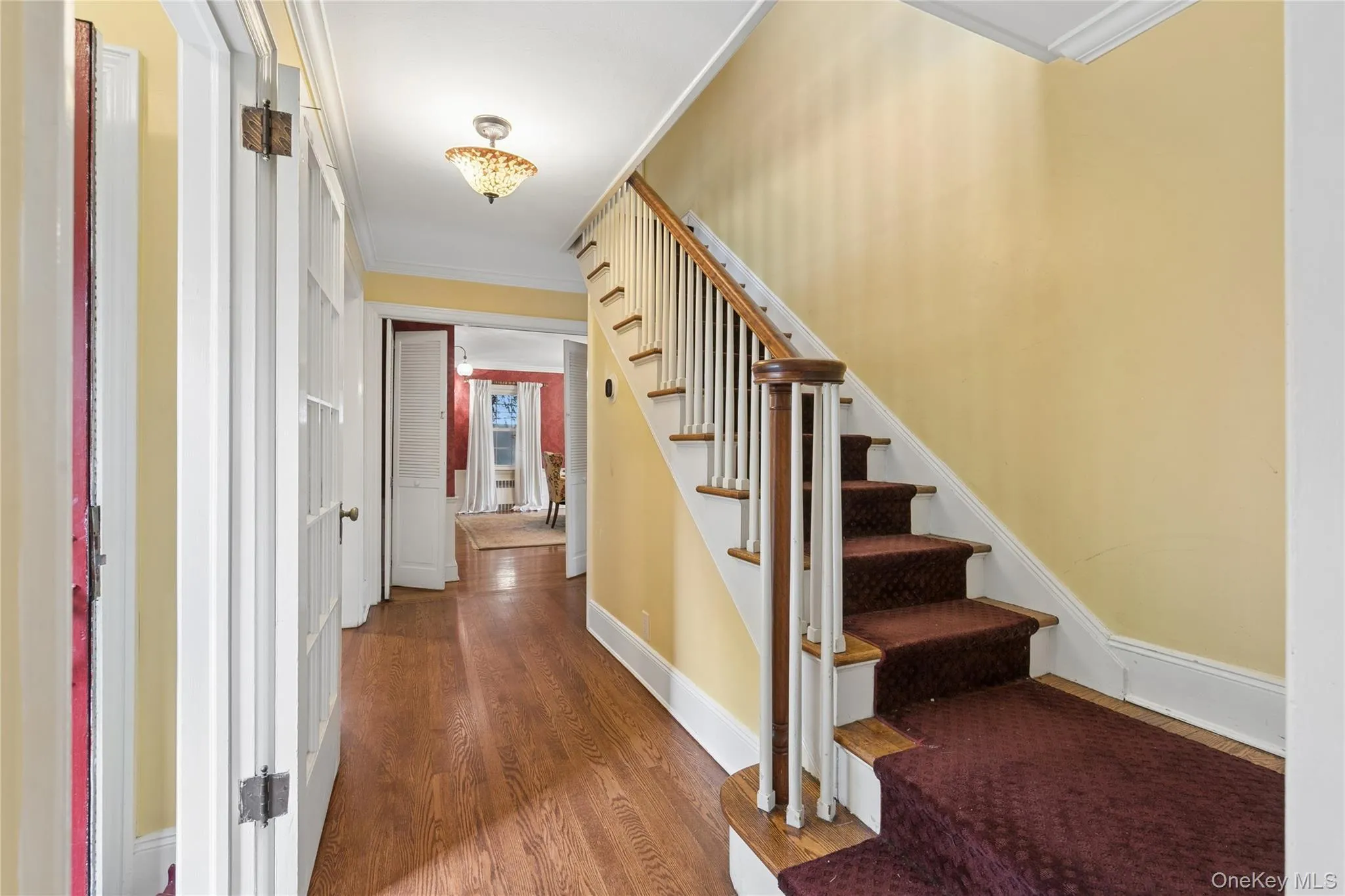 Front hall with classic staircase Front hall with classic staircase