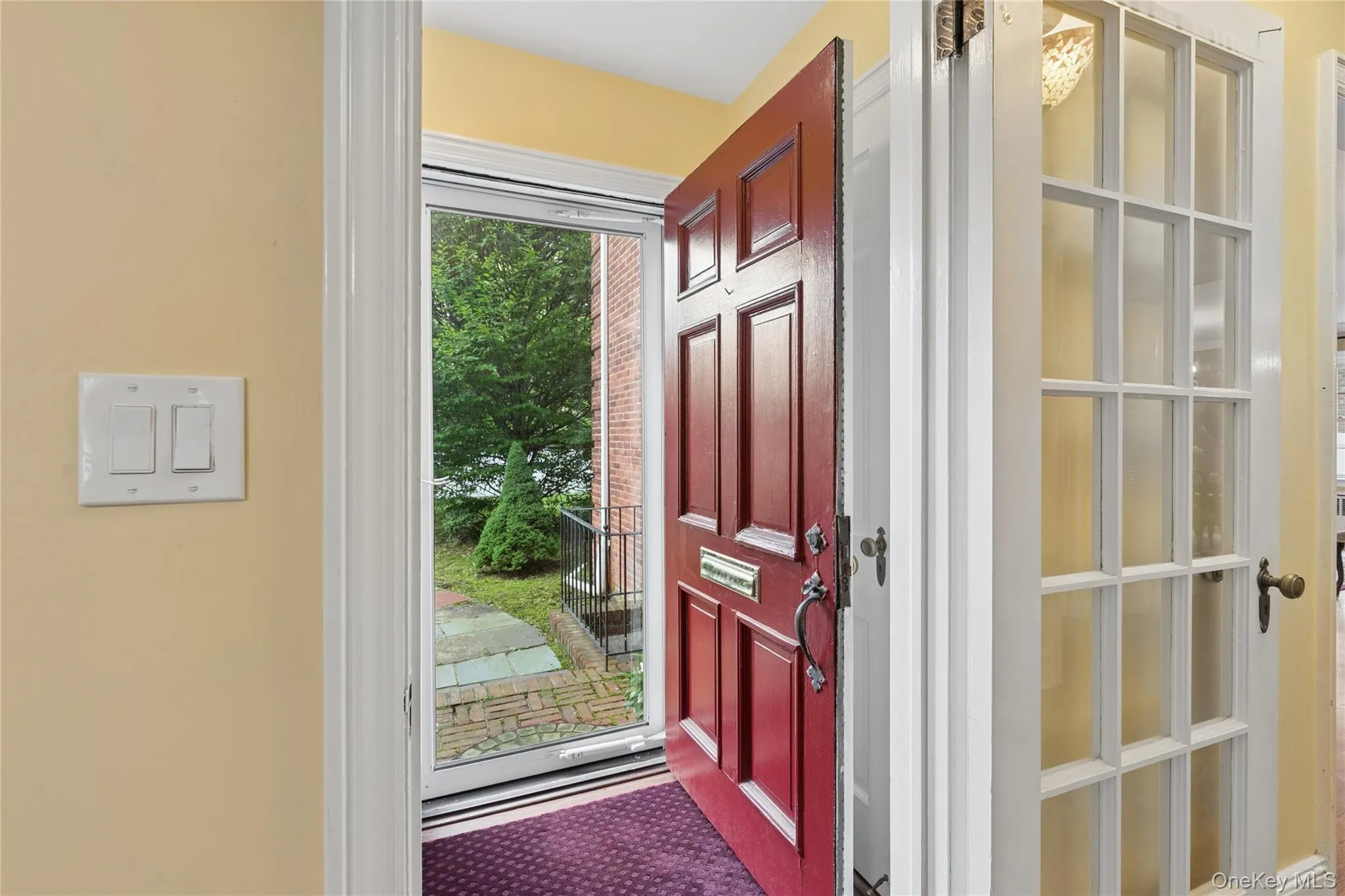 Gracious and welcoming foyer with guest closet Gracious and welcoming foyer with guest closet