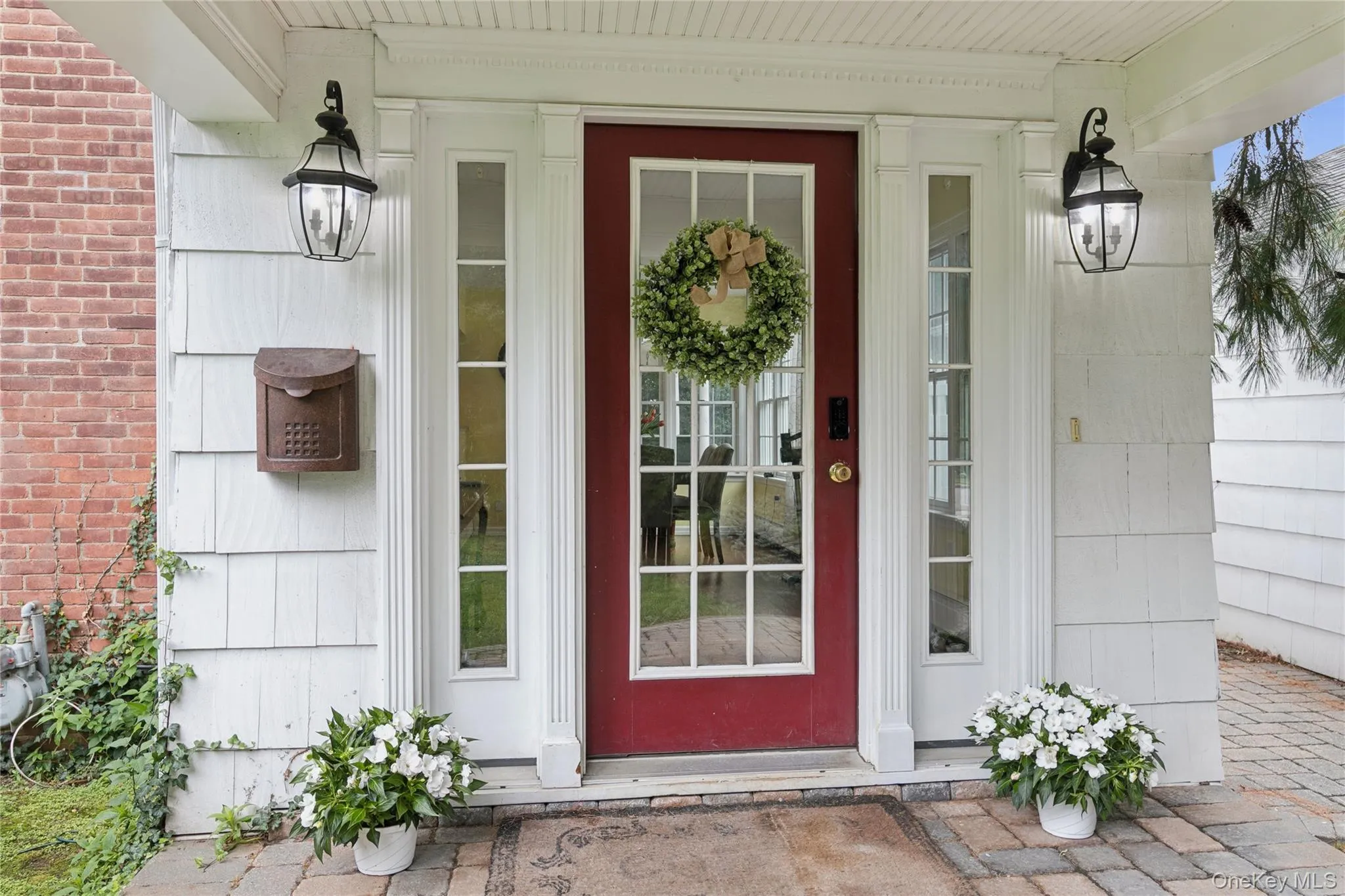 Covered side door entrance with delightful porch overlooks the side/front yard. Covered side door entrance with delightful porch overlooks the side/front yard.