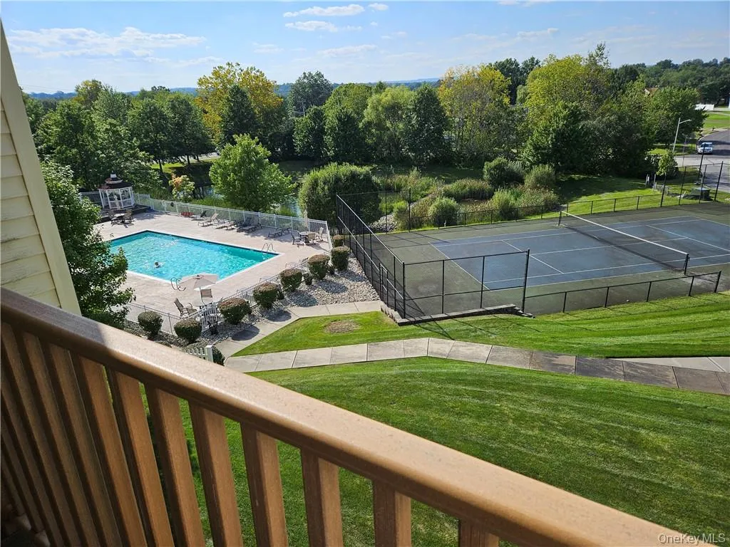 Pool and tennis court As seen from the balcony. Pool and tennis court As seen from the balcony.