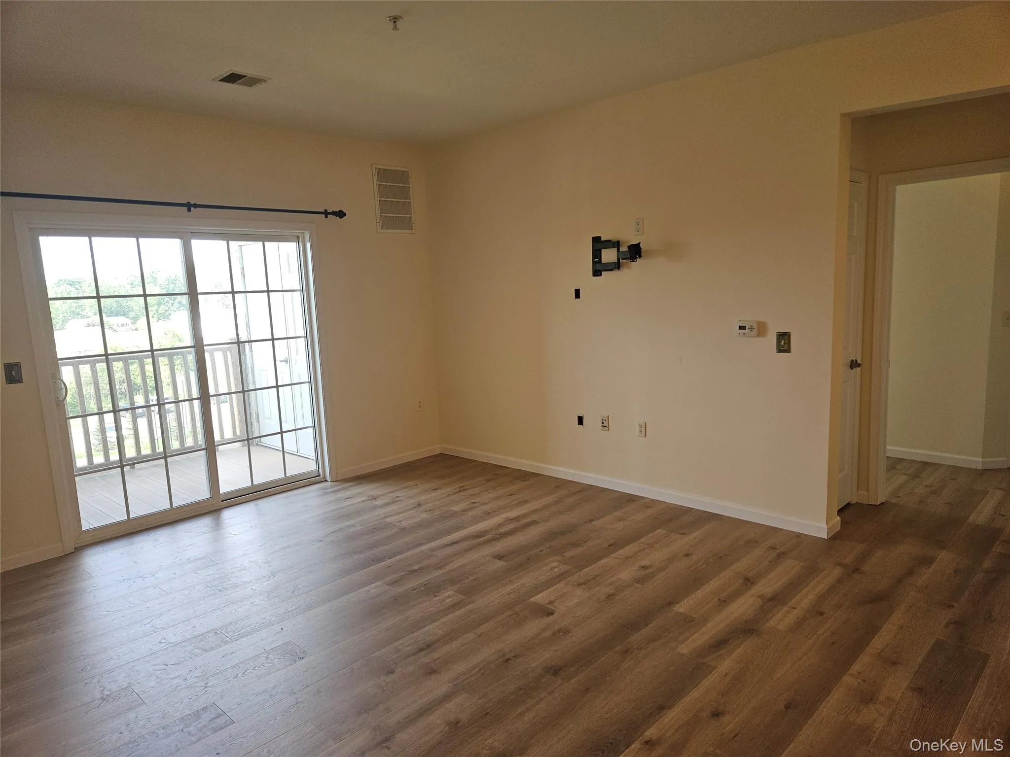 Door on right leads to primary en suite bedrooms and bath. Door on right leads to primary en suite bedrooms and bath.