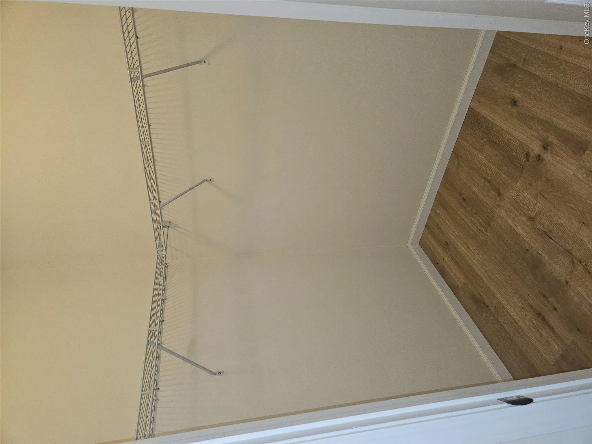 Primary bedroom walk-in closet. Primary bedroom walk-in closet.