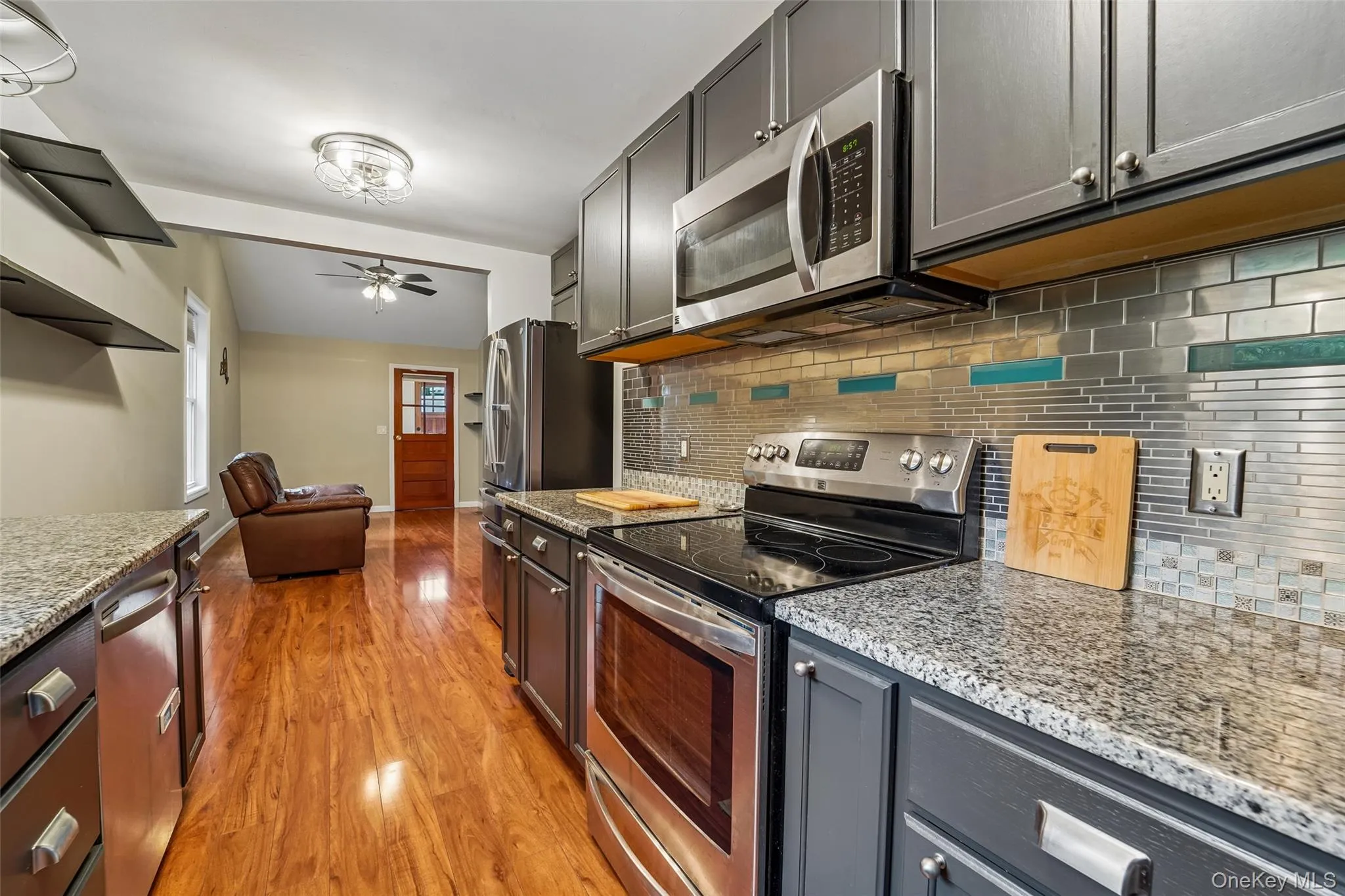 Kitchen with stainless steel appliances and granite counters. Kitchen with stainless steel appliances and granite counters.