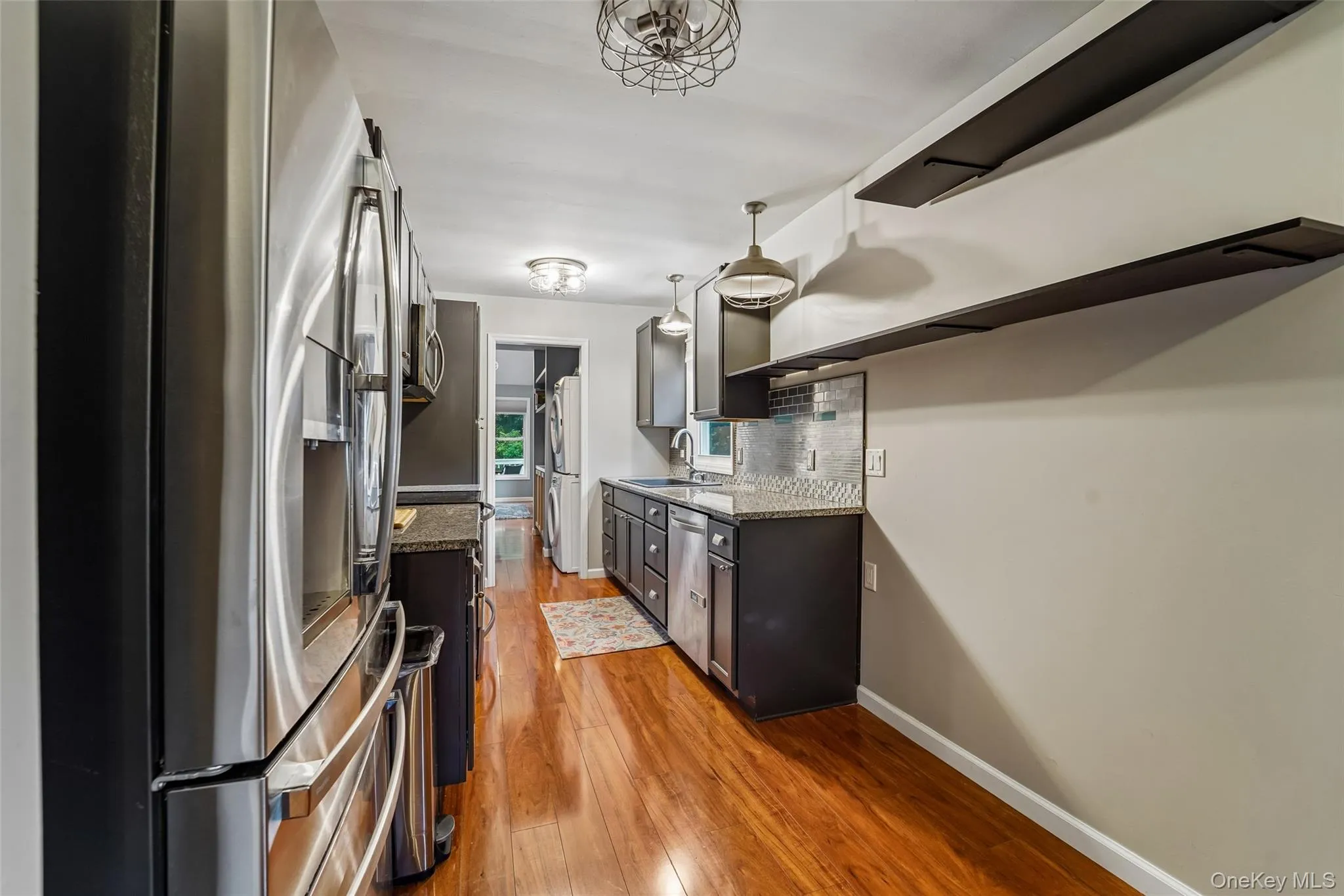 Kitchen with stainless steel appliances and granite counters. Kitchen with stainless steel appliances and granite counters.
