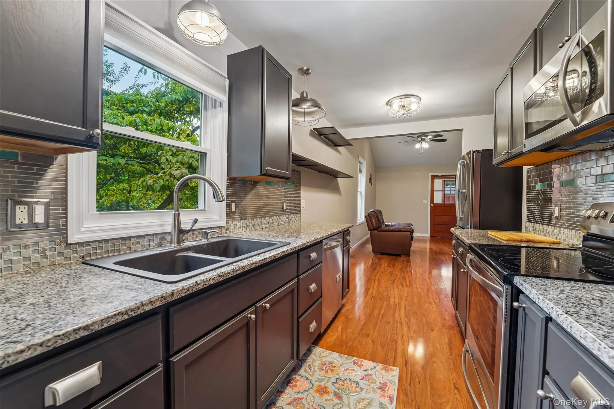Kitchen with stainless steel appliances and granite counters. Kitchen with stainless steel appliances and granite counters.