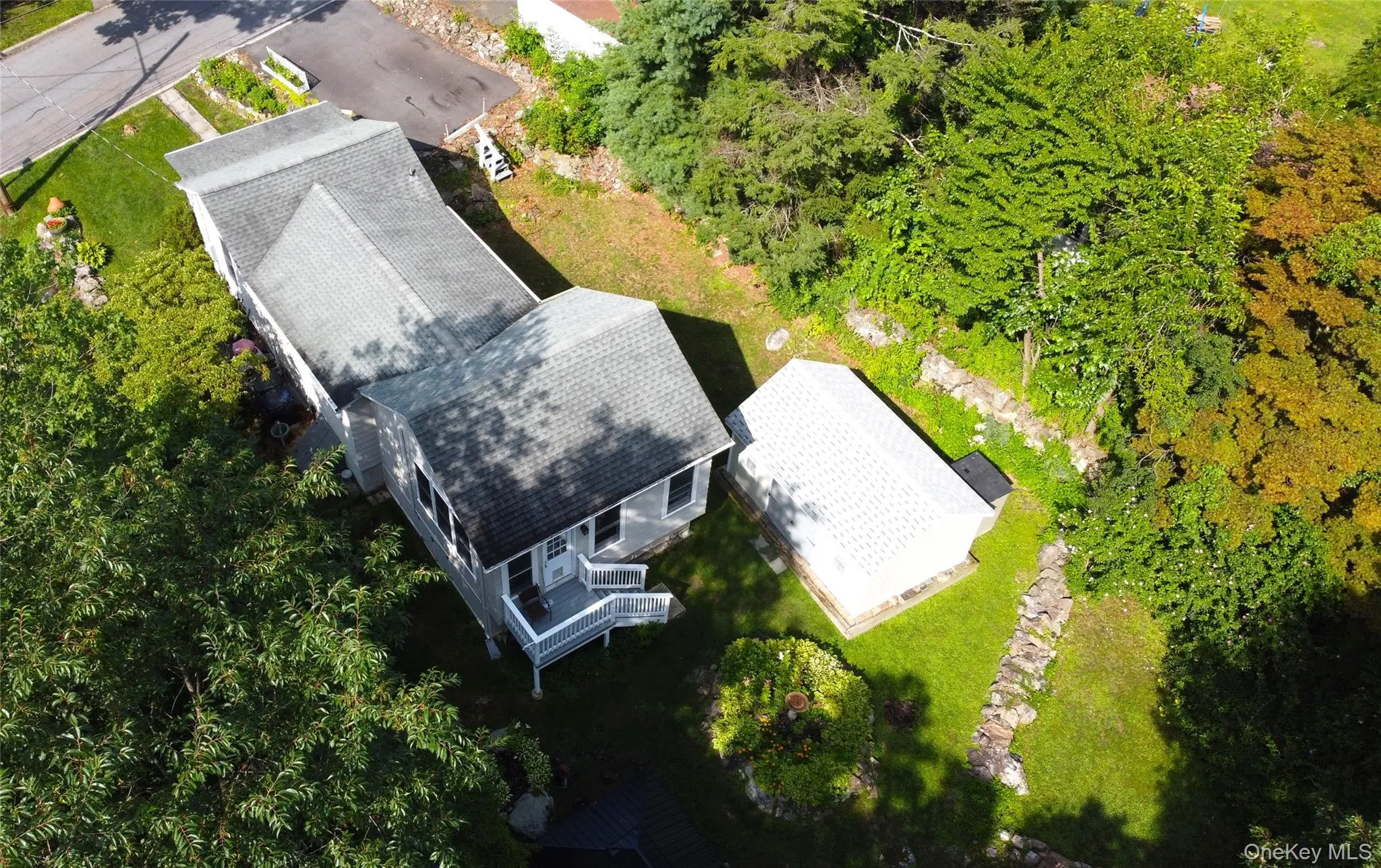 Aerial view of rear and east side of home. Aerial view of rear and east side of home.