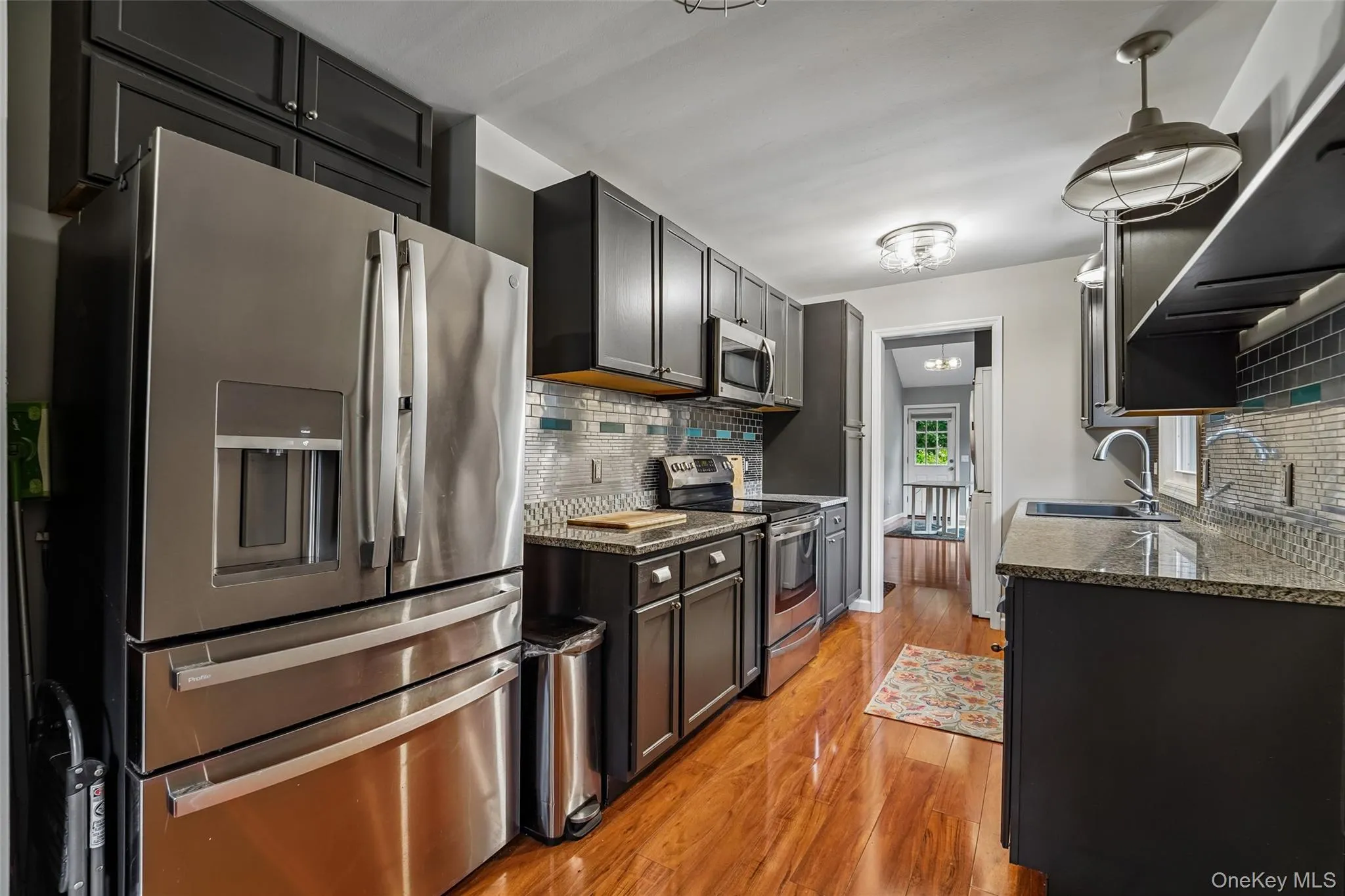 Kitchen with stainless steel appliances and granite counters. Kitchen with stainless steel appliances and granite counters.