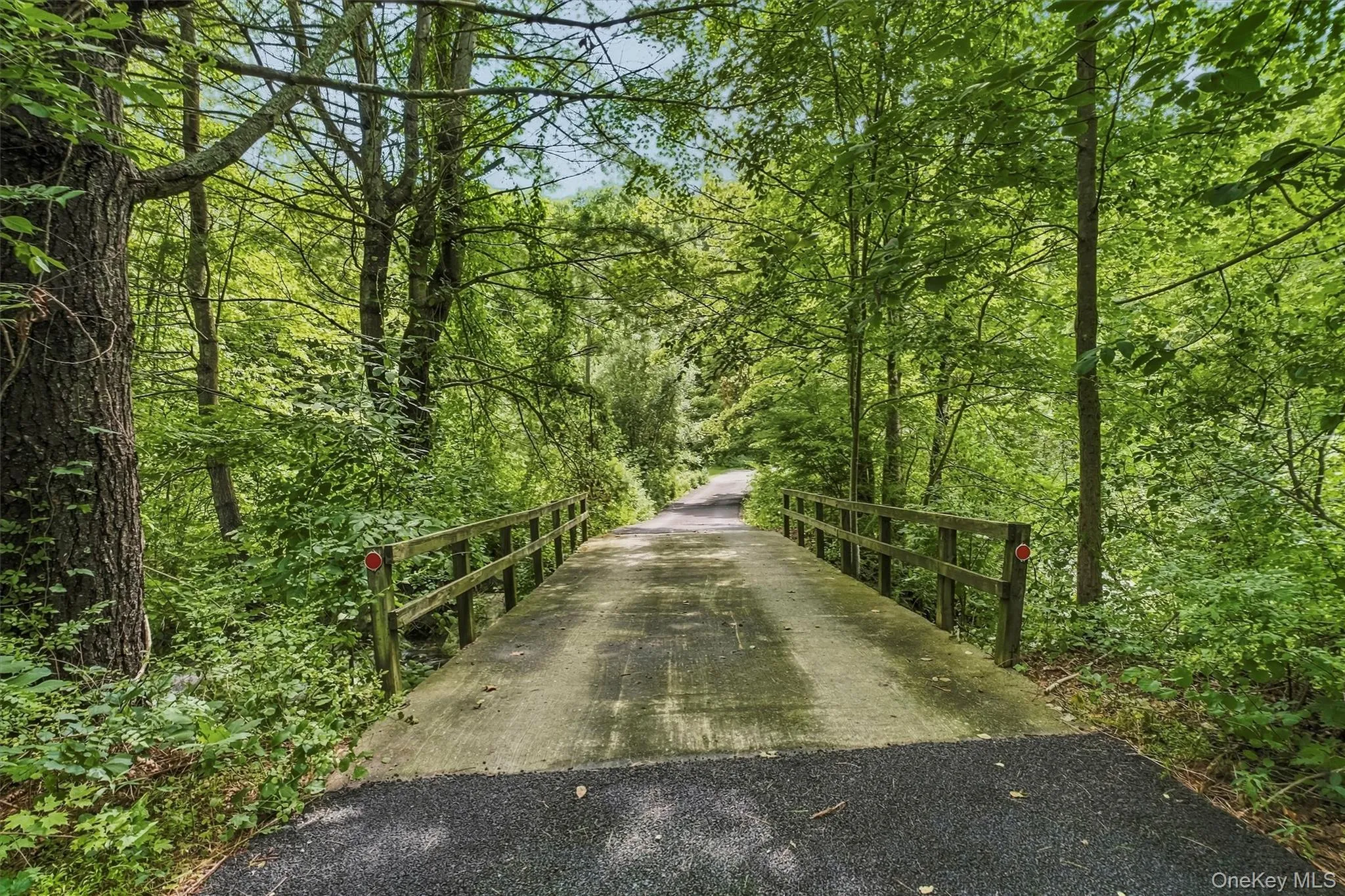 Privacy abounds as you travel over your own bridge into a natural sanctuary Privacy abounds as you travel over your own bridge into a natural sanctuary