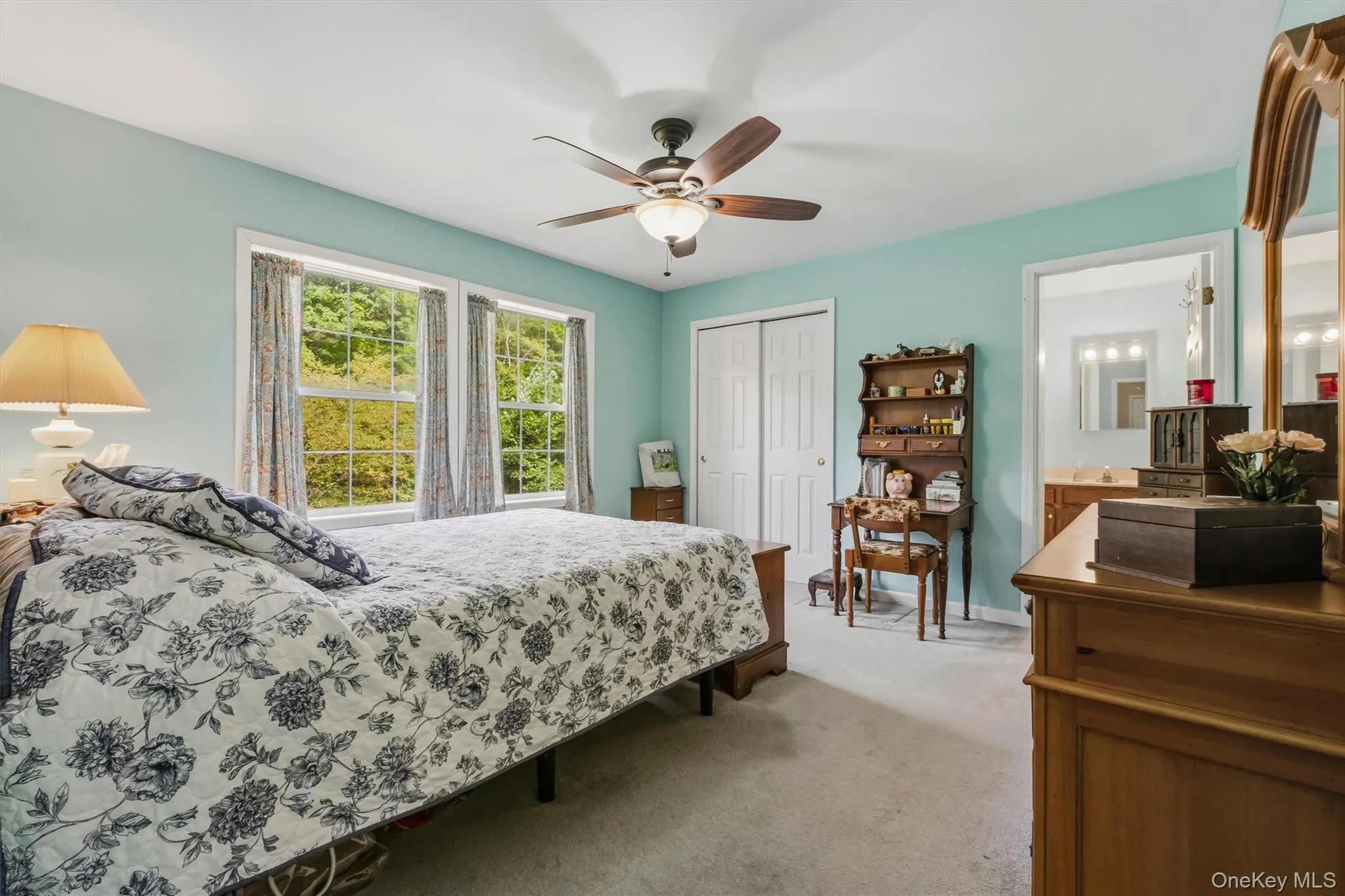 Just off the living room the primary bedroom offers morning sunshine and private en suite Just off the living room the primary bedroom offers morning sunshine and private en suite