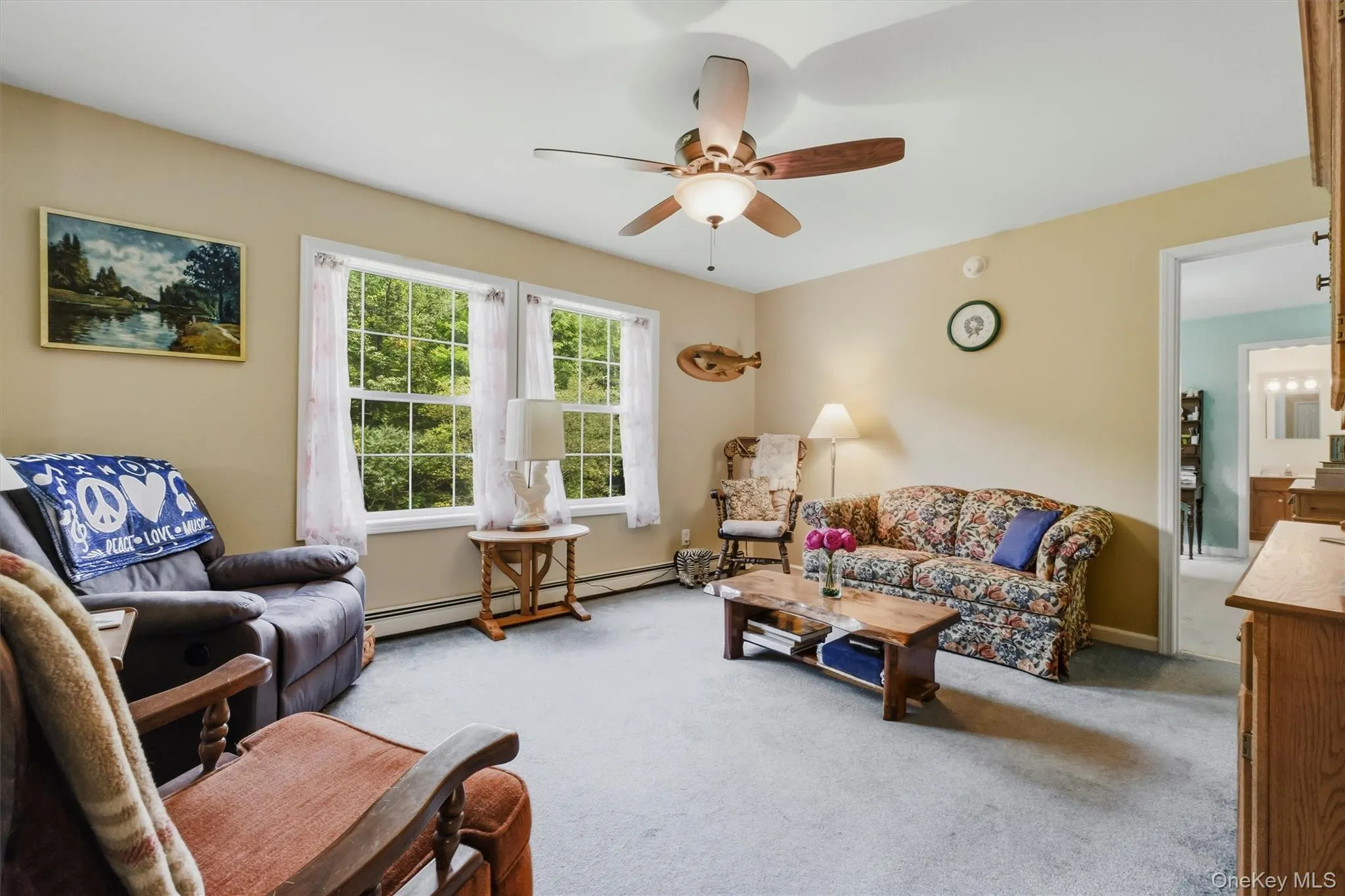 Just beyond the living room is the primary bedroom and bath Just beyond the living room is the primary bedroom and bath