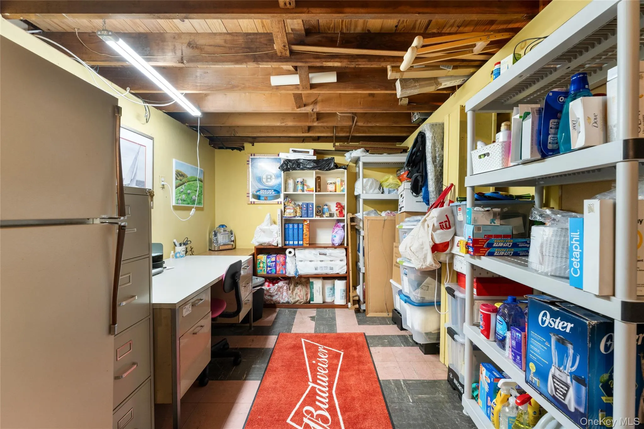 Partially finished basement with pantry storage and work space Partially finished basement with pantry storage and work space
