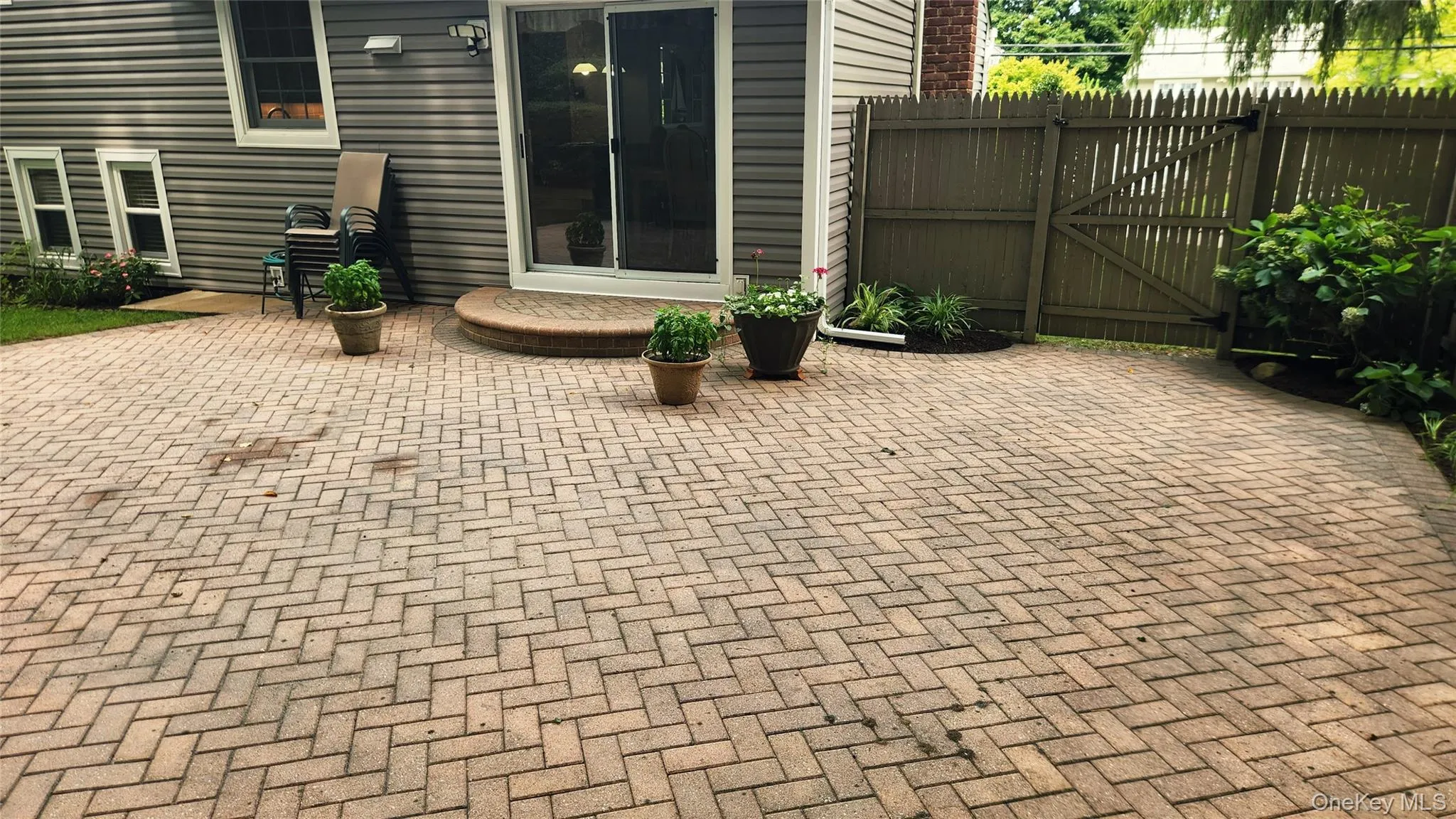 Sliding doors that lead to brick patio Sliding doors that lead to brick patio