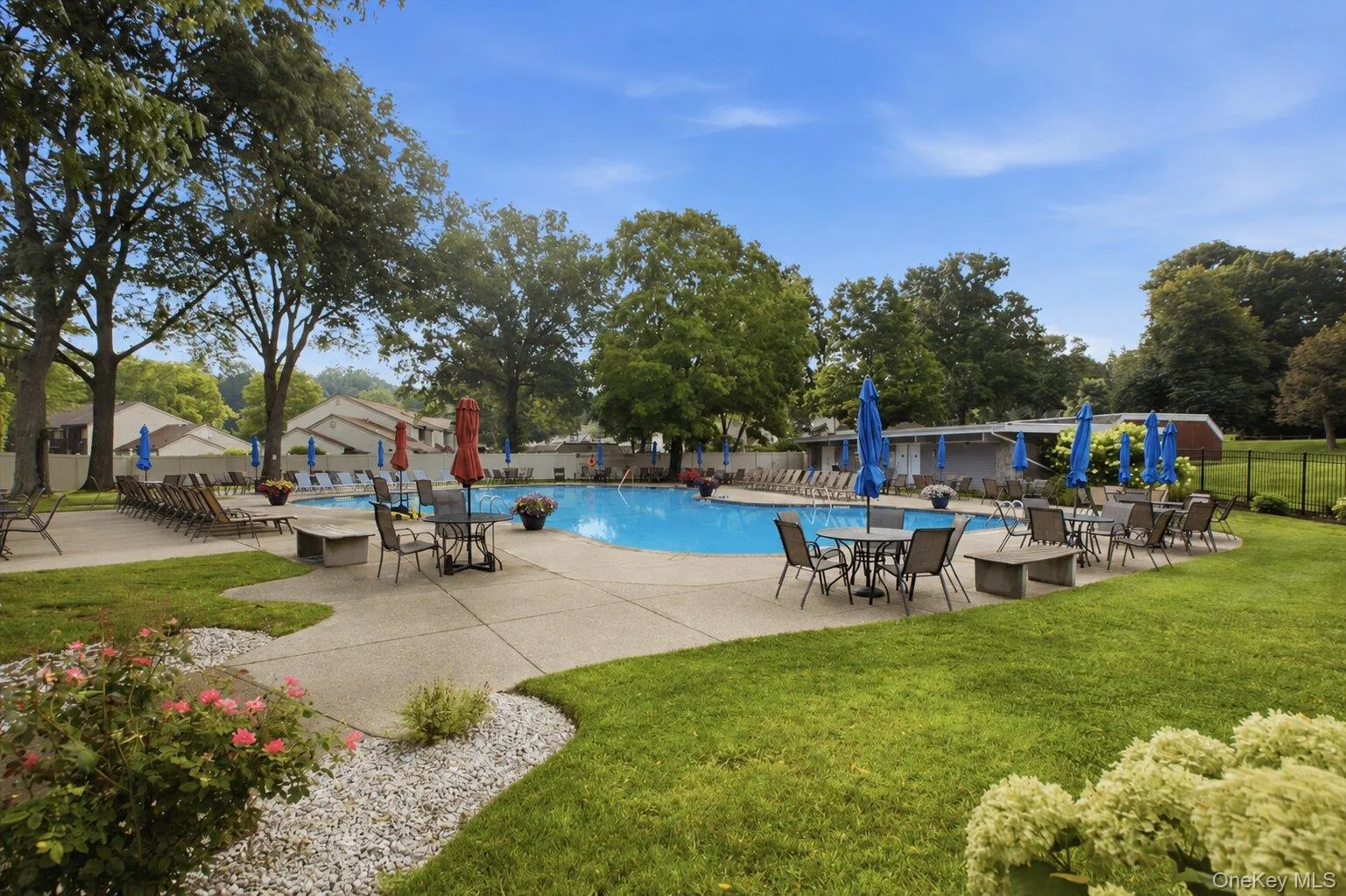 Community Pool with Plenty of Seating, Tables and Chairs Community Pool with Plenty of Seating, Tables and Chairs