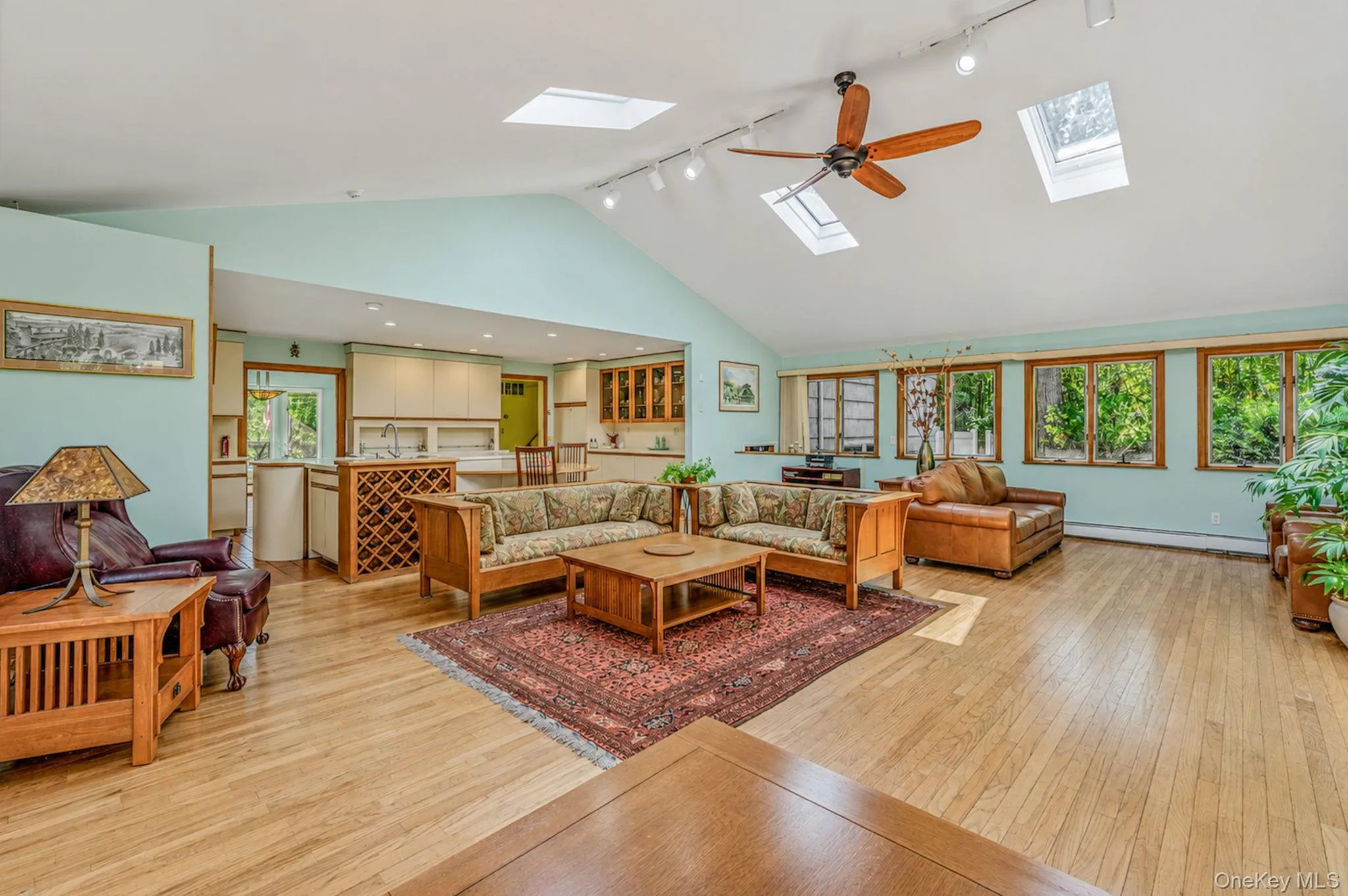 Stunning Great Room with HW Floors, Soaring Ceilings, Skylights, Tons of Windows, Open Flow to EIK, Sliders to Back Deck Stunning Great Room with HW Floors, Soaring Ceilings, Skylights, Tons of Windows, Open Flow to EIK, Sliders to Back Deck