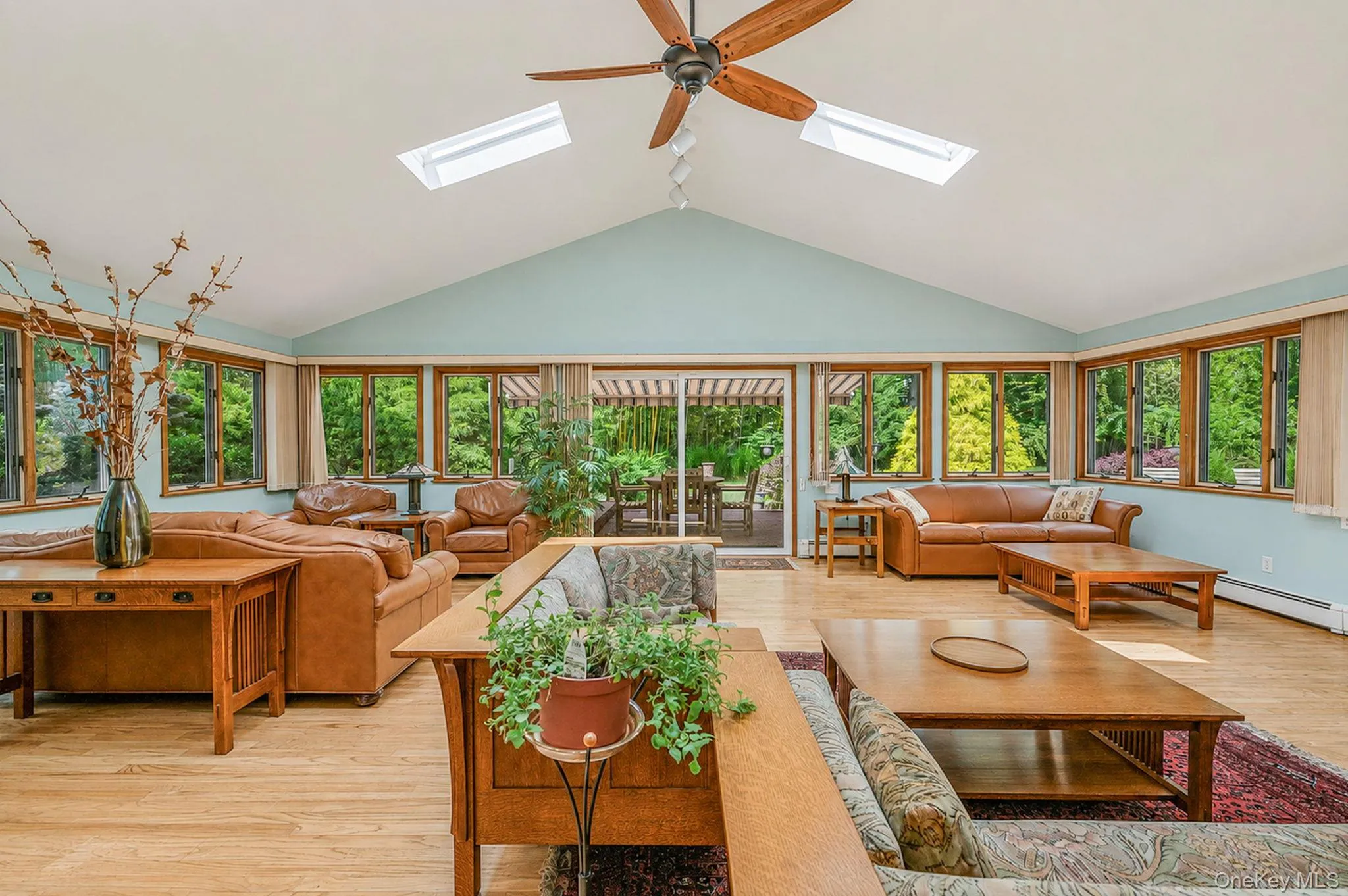 Stunning Great Room with HW Floors, Soaring Ceilings, Skylights, Tons of Windows, Open Flow to EIK, Sliders to Back Deck Stunning Great Room with HW Floors, Soaring Ceilings, Skylights, Tons of Windows, Open Flow to EIK, Sliders to Back Deck
