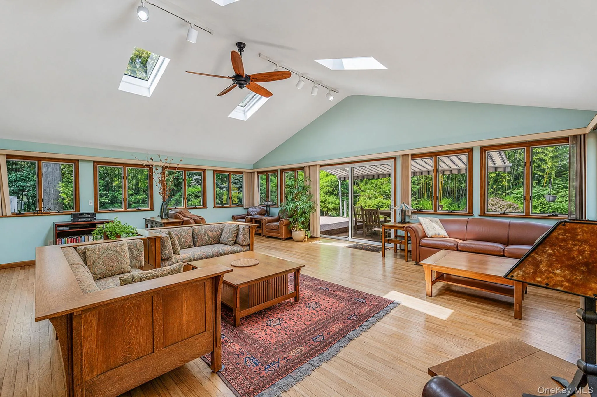 Stunning Great Room with HW Floors, Soaring Ceilings, Skylights, Tons of Windows, Open Flow to EIK, Sliders to Back Deck Stunning Great Room with HW Floors, Soaring Ceilings, Skylights, Tons of Windows, Open Flow to EIK, Sliders to Back Deck