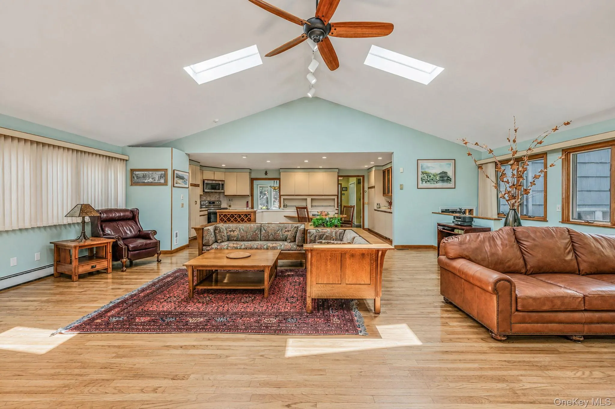 Stunning Great Room with HW Floors, Soaring Ceilings, Skylights, Tons of Windows, Open Flow to EIK, Sliders to Back Deck Stunning Great Room with HW Floors, Soaring Ceilings, Skylights, Tons of Windows, Open Flow to EIK, Sliders to Back Deck