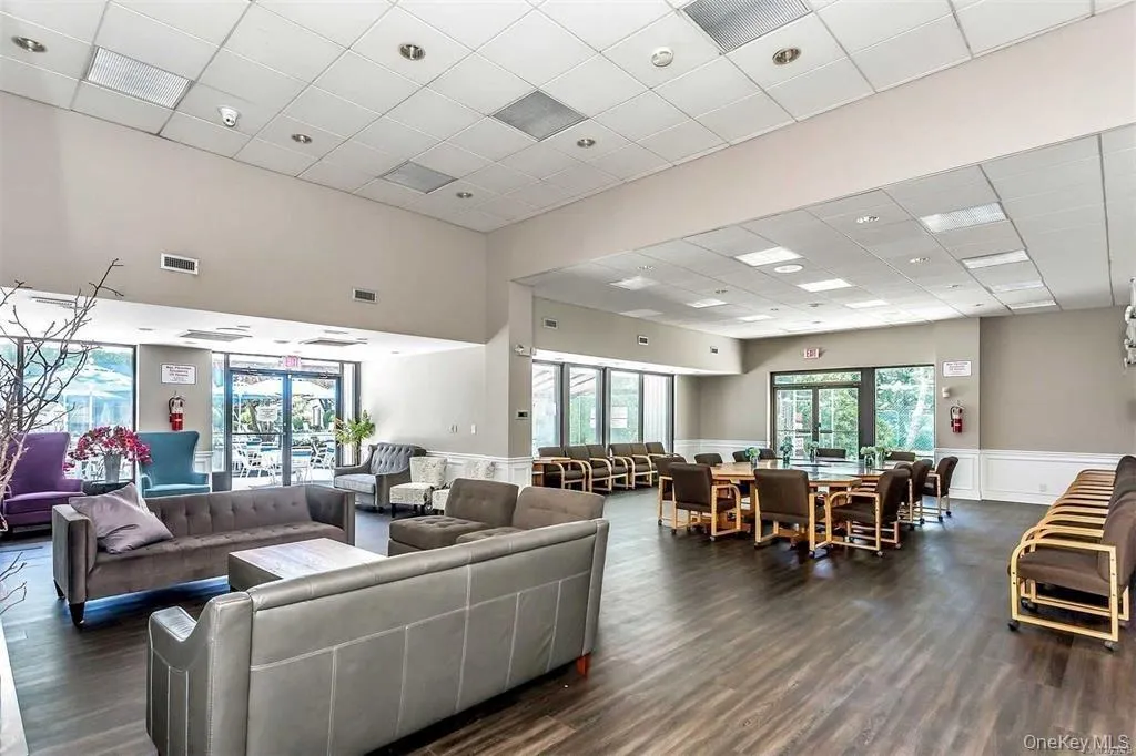 Building lobby featuring a drop ceiling Building lobby featuring a drop ceiling