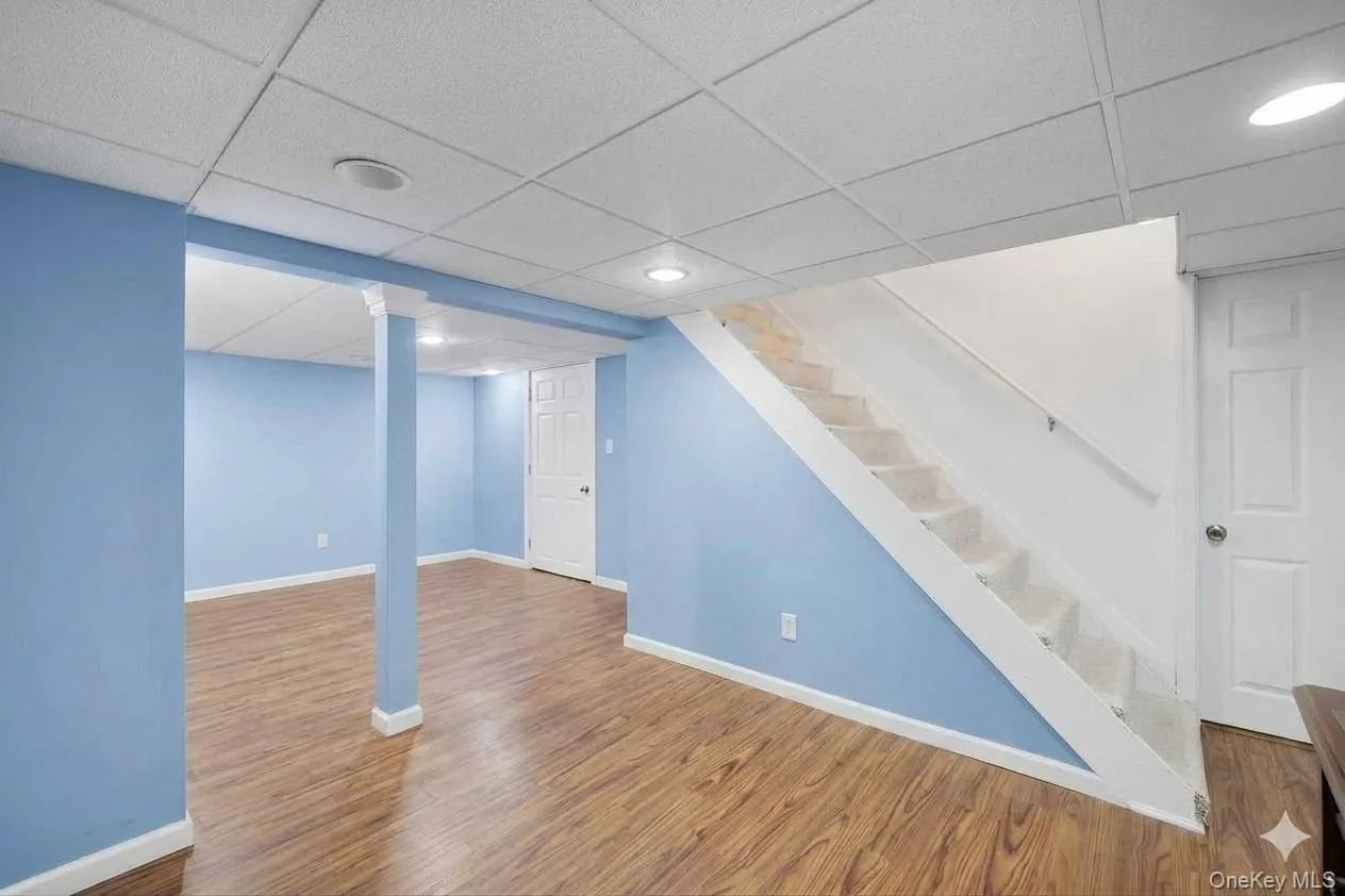 Partially finished basement. AI edited to remove all existing furniture. Partially finished basement. AI edited to remove all existing furniture.