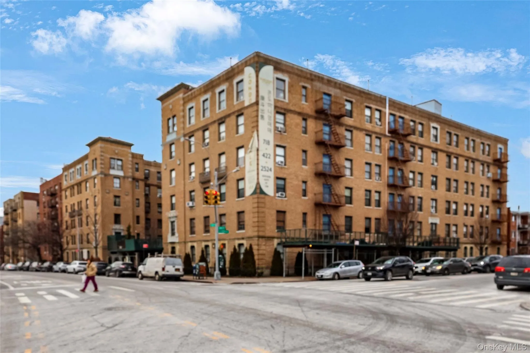 Brick exterior building featuring multiple levels and window units Brick exterior building featuring multiple levels and window units