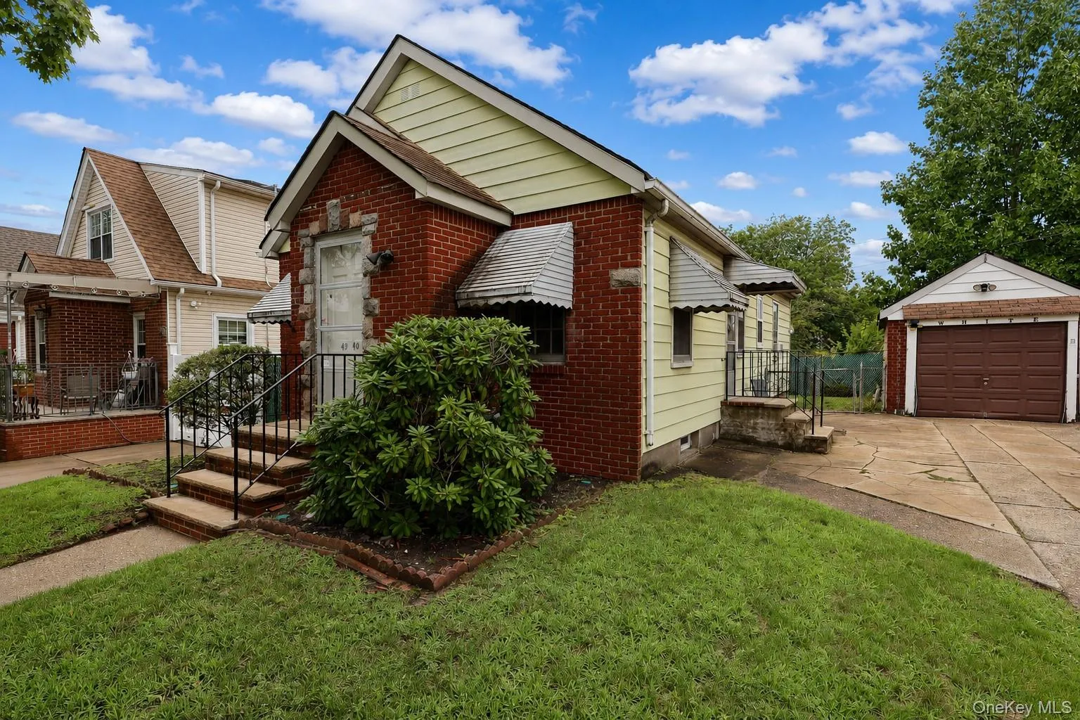 Brick and siding exterior residence with an attached single-car garage Brick and siding exterior residence with an attached single-car garage
