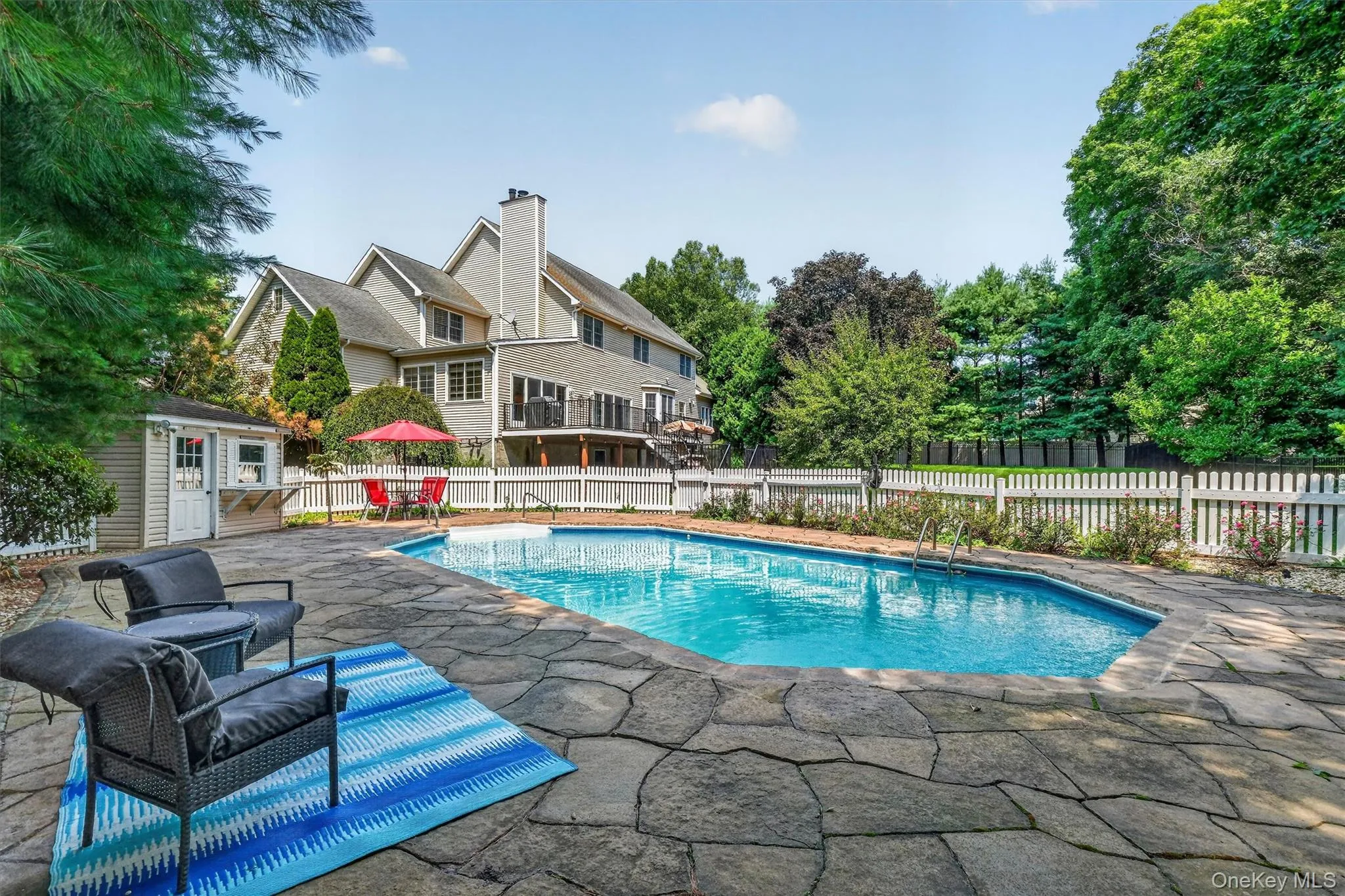 A heated in-ground pool is beautifully framed by tasteful stonework and surrounded by ample space for outdoor furniture. A heated in-ground pool is beautifully framed by tasteful stonework and surrounded by ample space for outdoor furniture.