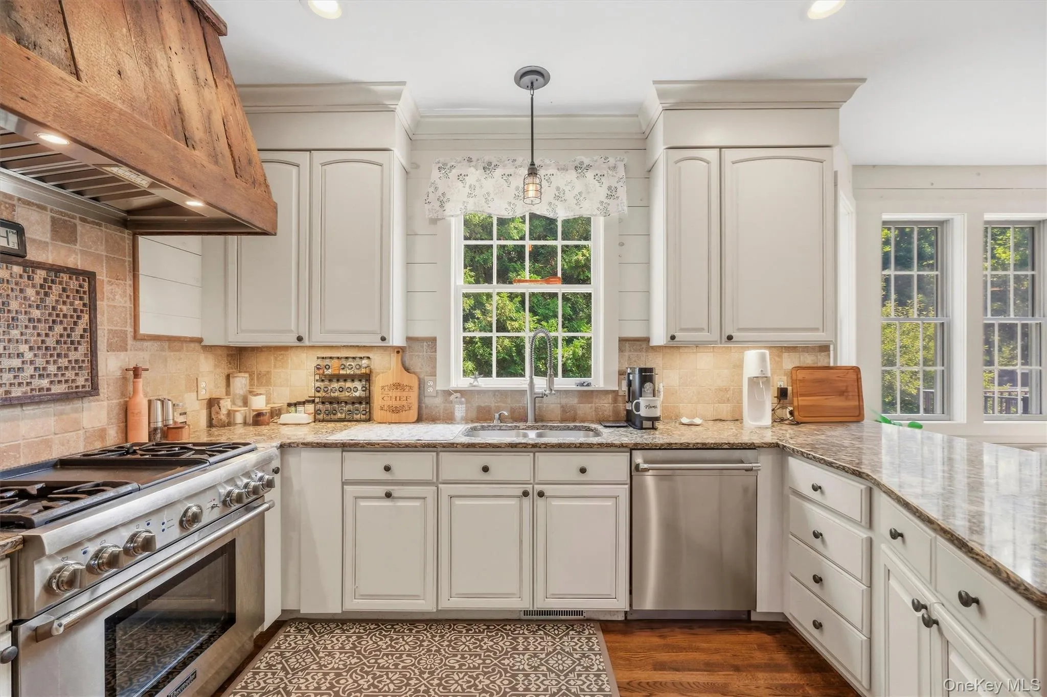 The kitchen boasts of high-end, stainless steel Thermador appliances. The kitchen boasts of high-end, stainless steel Thermador appliances.