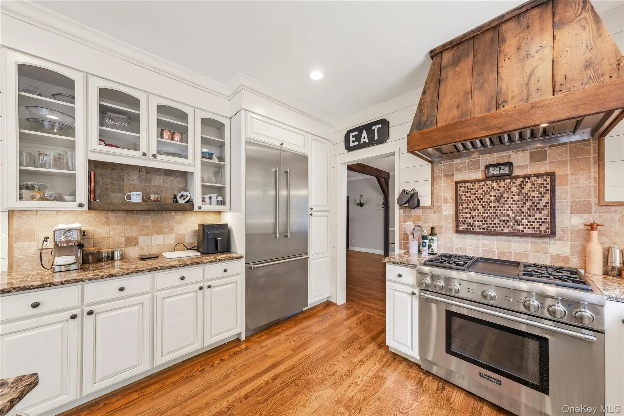Enter an inviting eat-in gourmet kitchen, thoughtfully designed with abundant workspace, ample storage, and charming architectural details. Enter an inviting eat-in gourmet kitchen, thoughtfully designed with abundant workspace, ample storage, and charming architectural details.