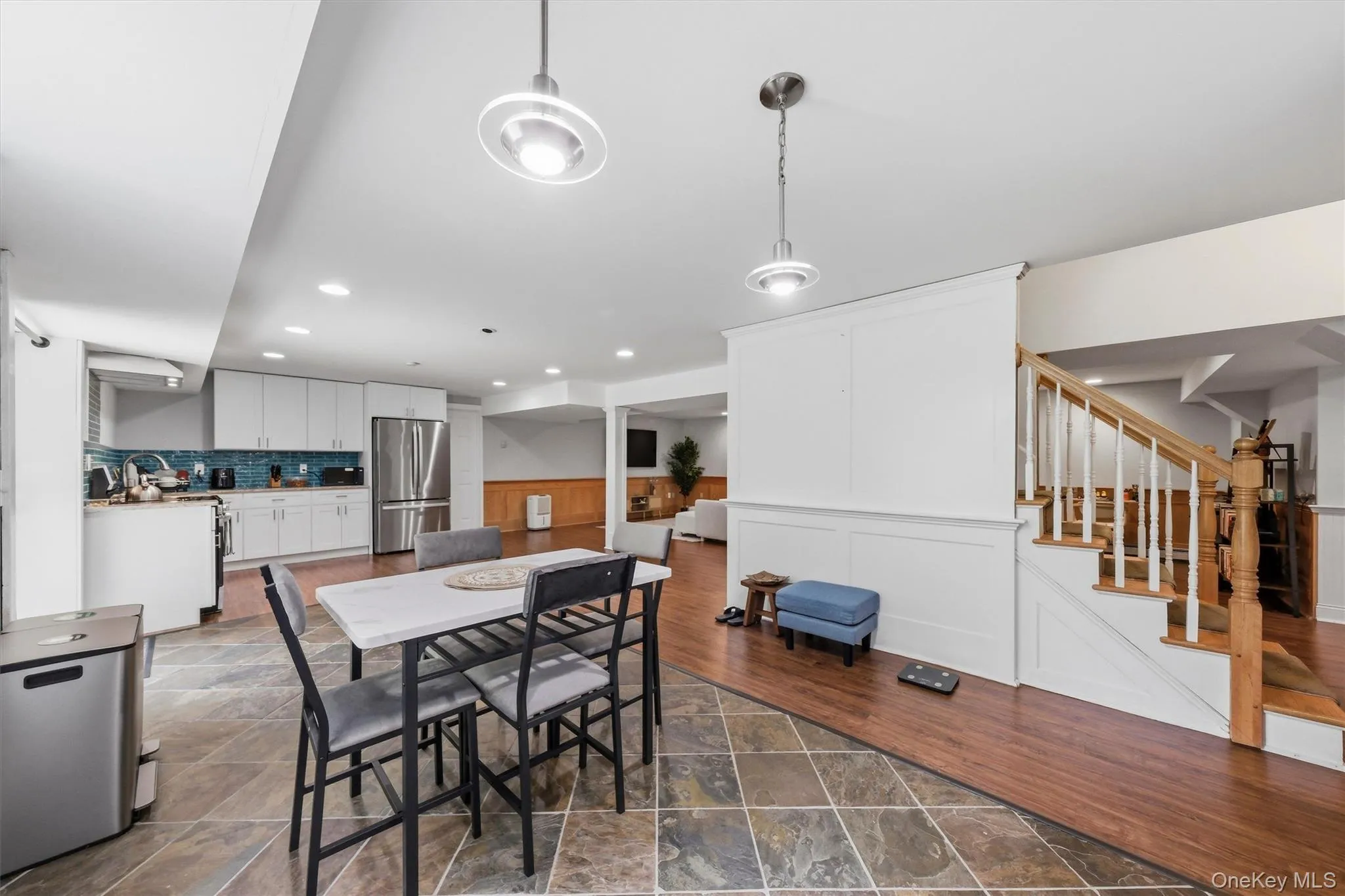 Lower-level dining area and kitchenette. Lower-level dining area and kitchenette.