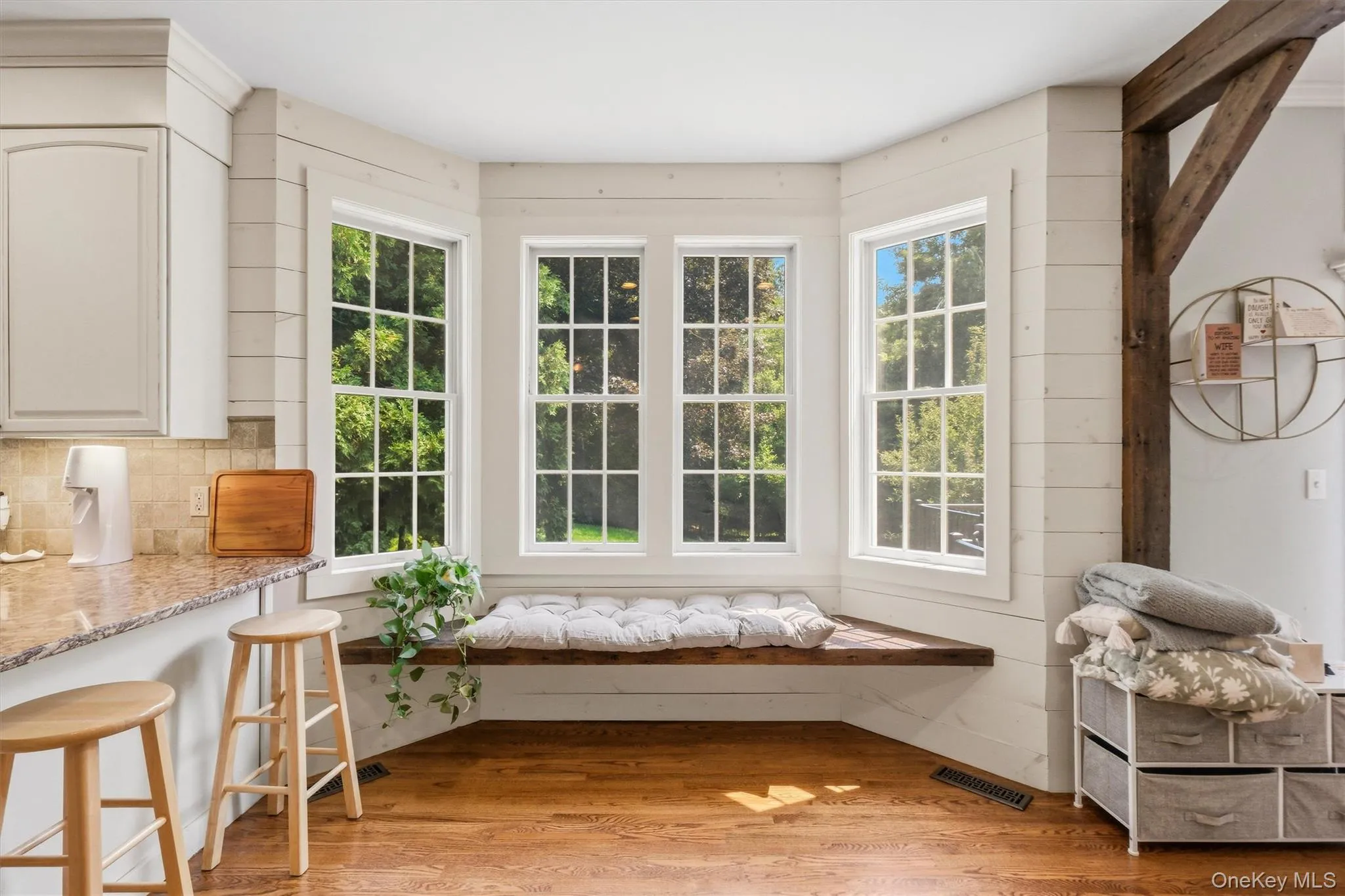 A charming window seat completes the eat-in kitchen. A charming window seat completes the eat-in kitchen.