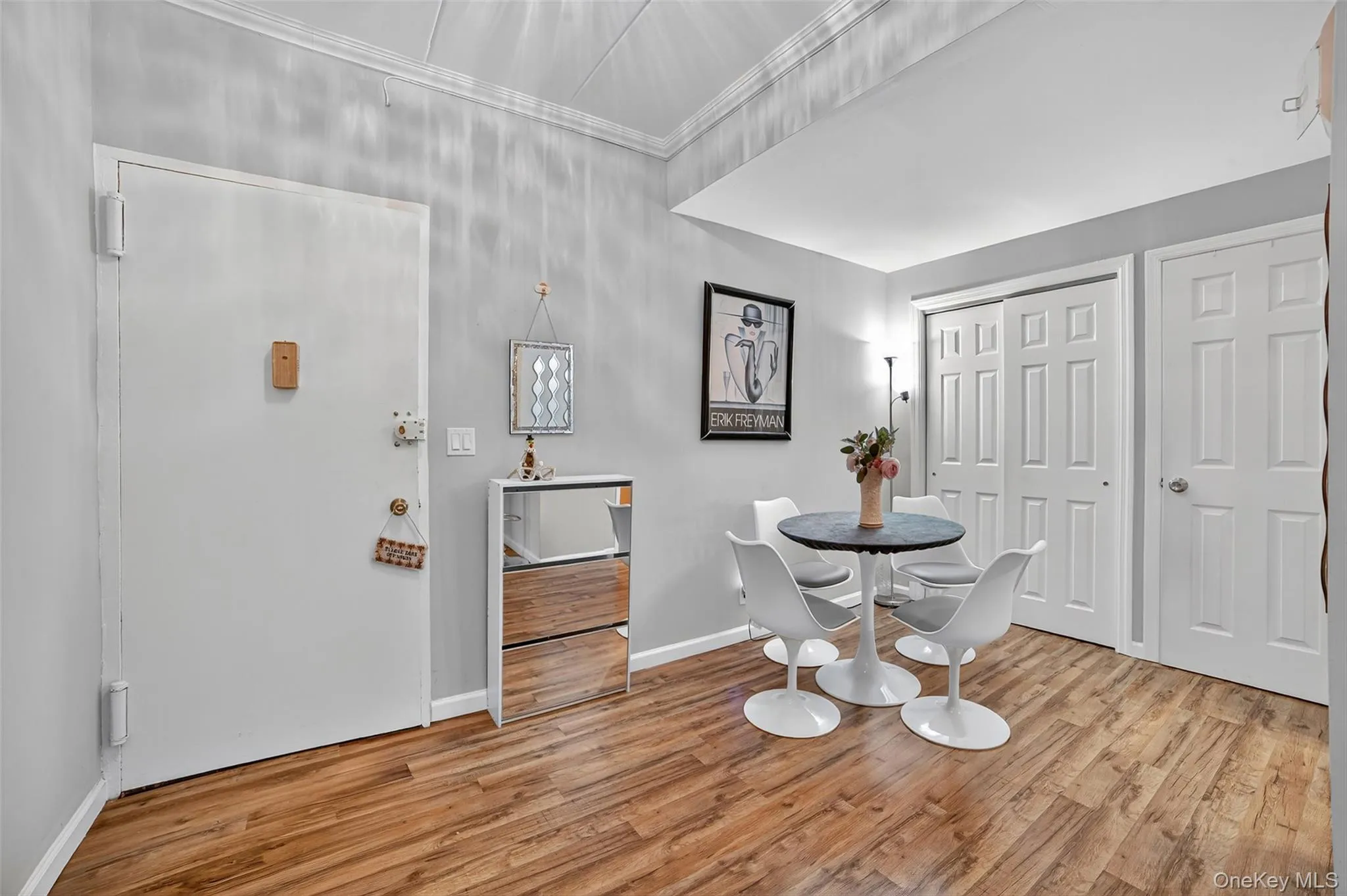 Dining area featuring light wood-type flooring and baseboards Dining area featuring light wood-type flooring and baseboards
