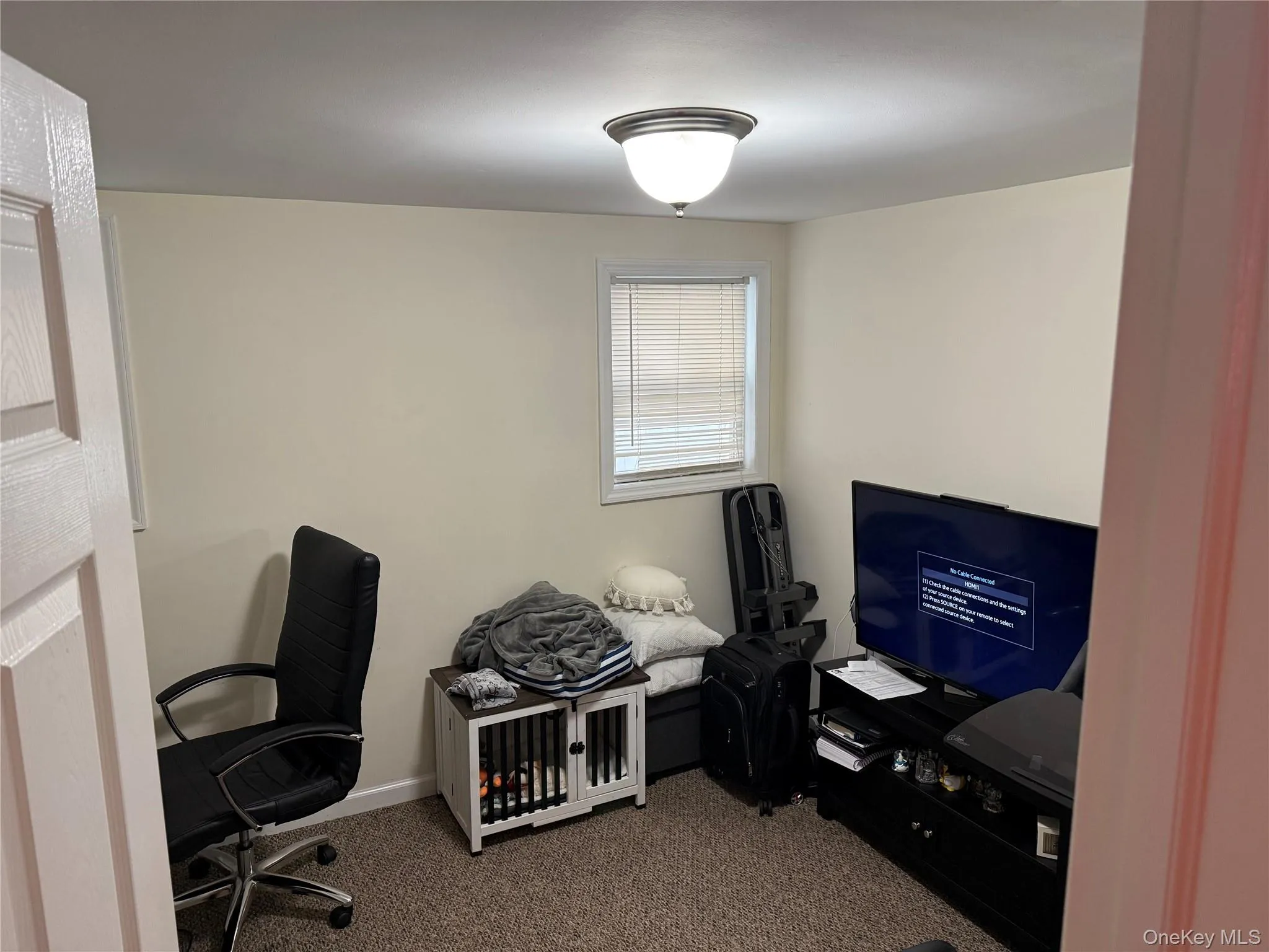 Bedrrom #2 currently used as an Office featuring carpet flooring and baseboards Bedrrom #2 currently used as an Office featuring carpet flooring and baseboards