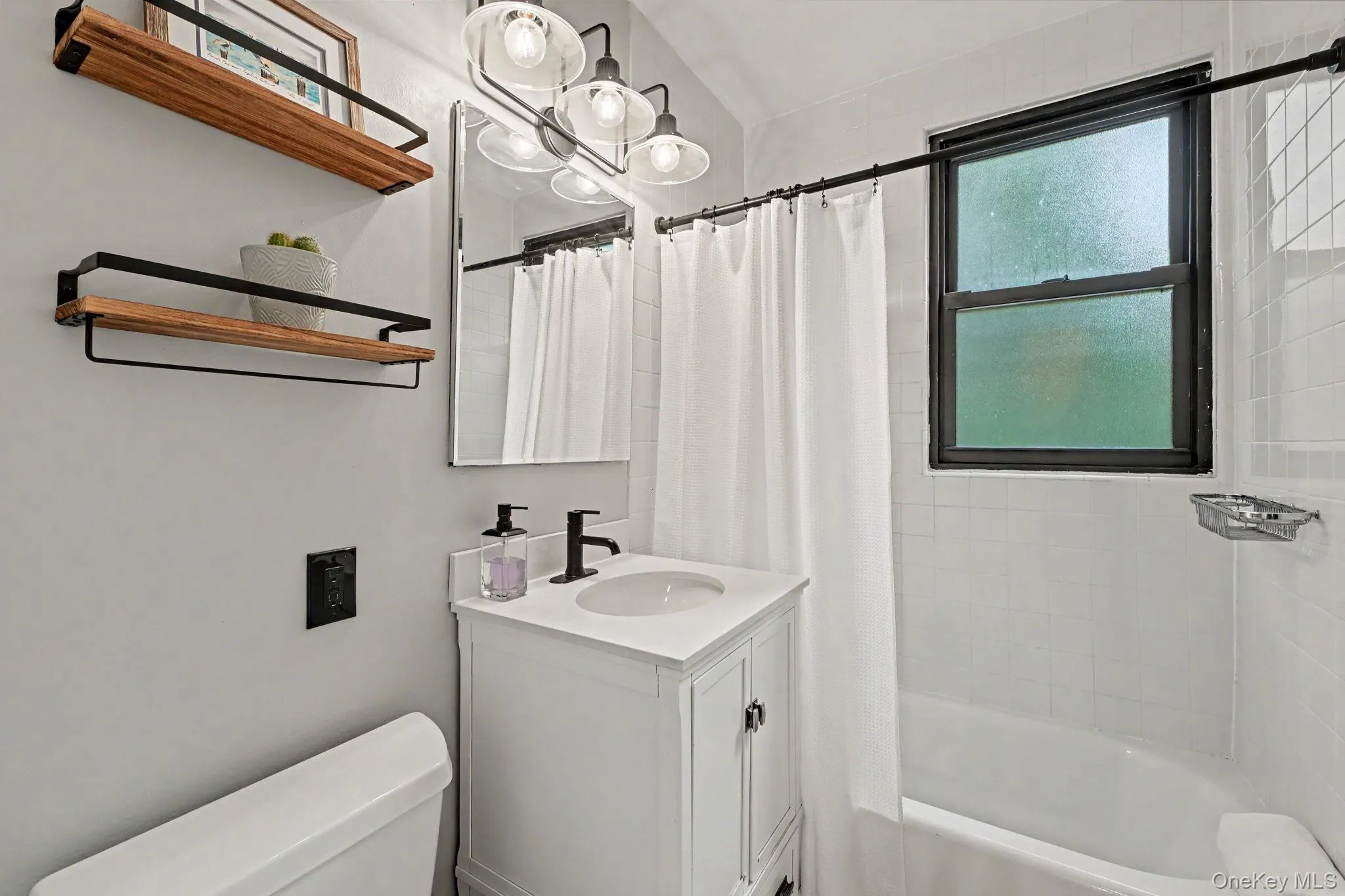 Updated hall bath with window. Updated hall bath with window.