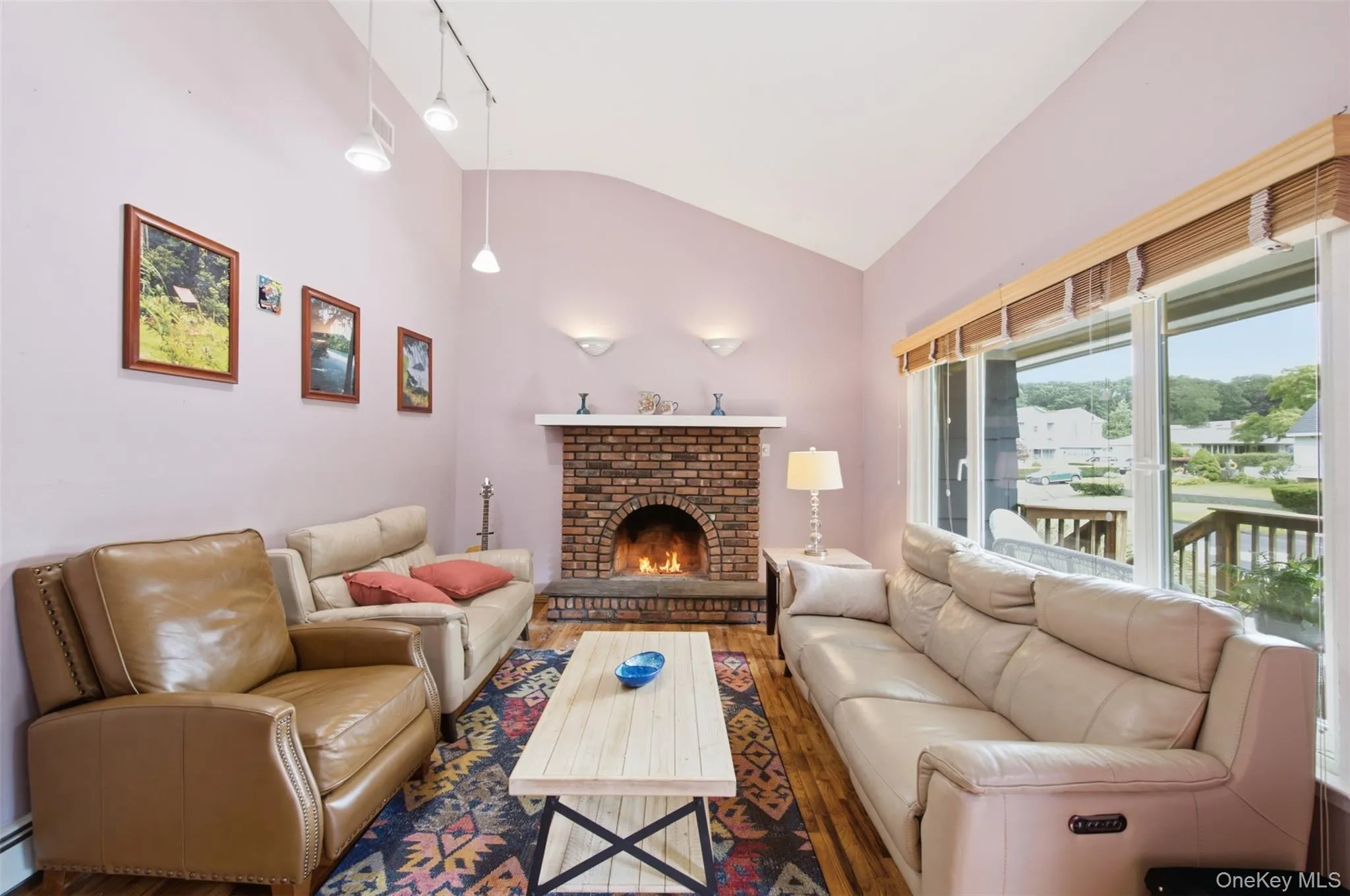 Wood floors and a wood- burning fireplace make this living space very inviting. Wood floors and a wood- burning fireplace make this living space very inviting.