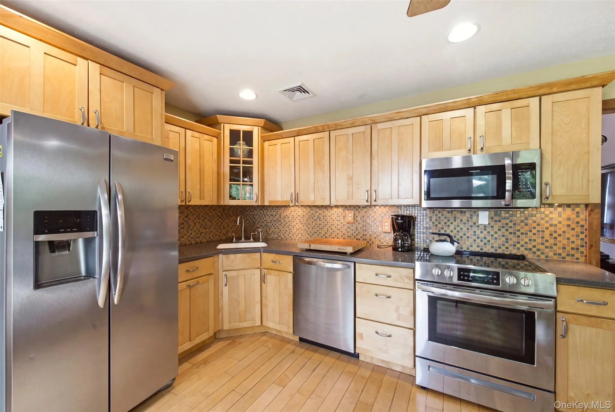 Meticulously maintained kitchen with stainless steel appliances. Meticulously maintained kitchen with stainless steel appliances.