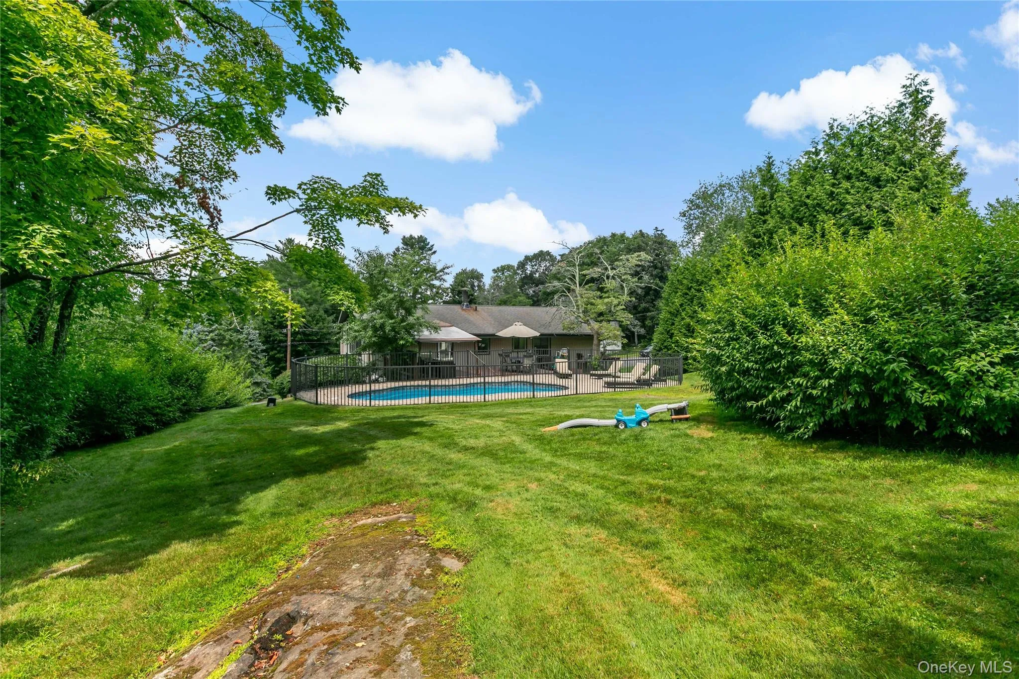 Backyard with distant mountain views. Backyard with distant mountain views.