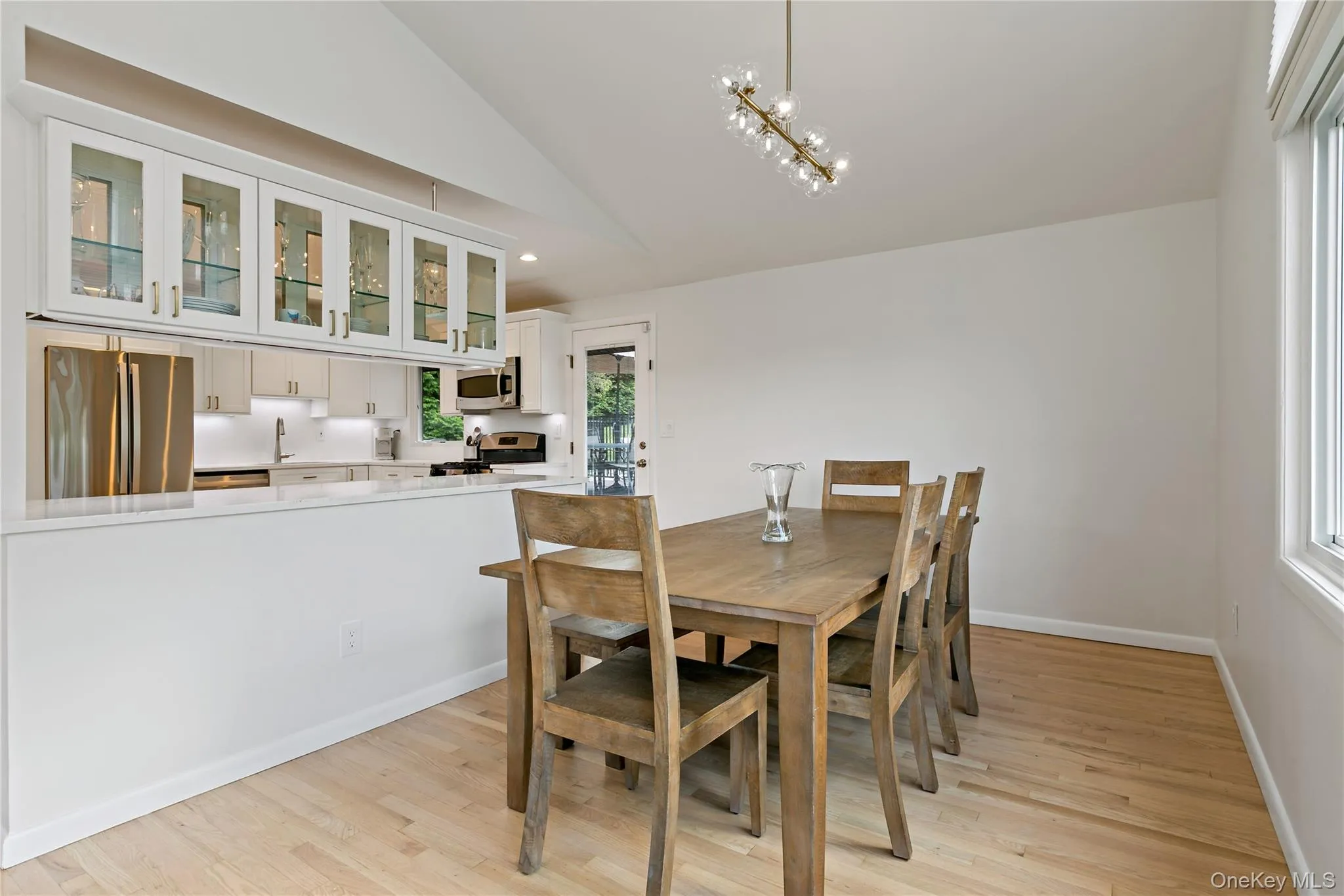 Dining room showing pass through to the kitchen. Door in background goes out to decking. Dining room showing pass through to the kitchen. Door in background goes out to decking.