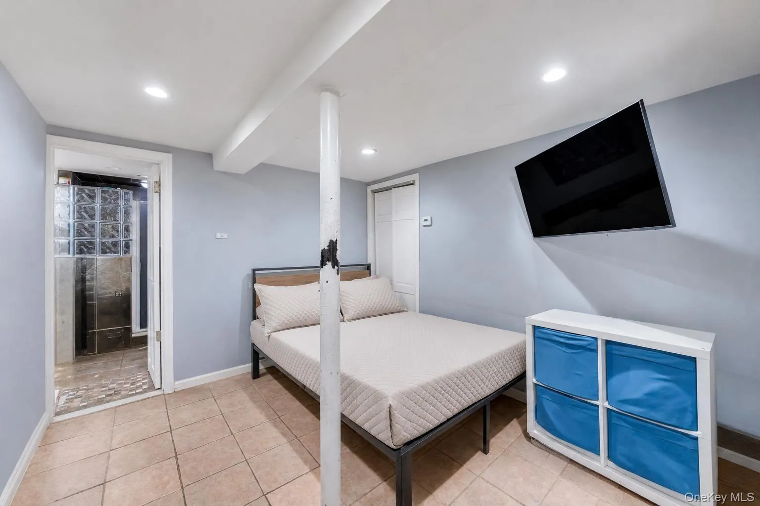 Room featuring neutral tile flooring, recessed lighting, and a white ceiling Room featuring neutral tile flooring, recessed lighting, and a white ceiling