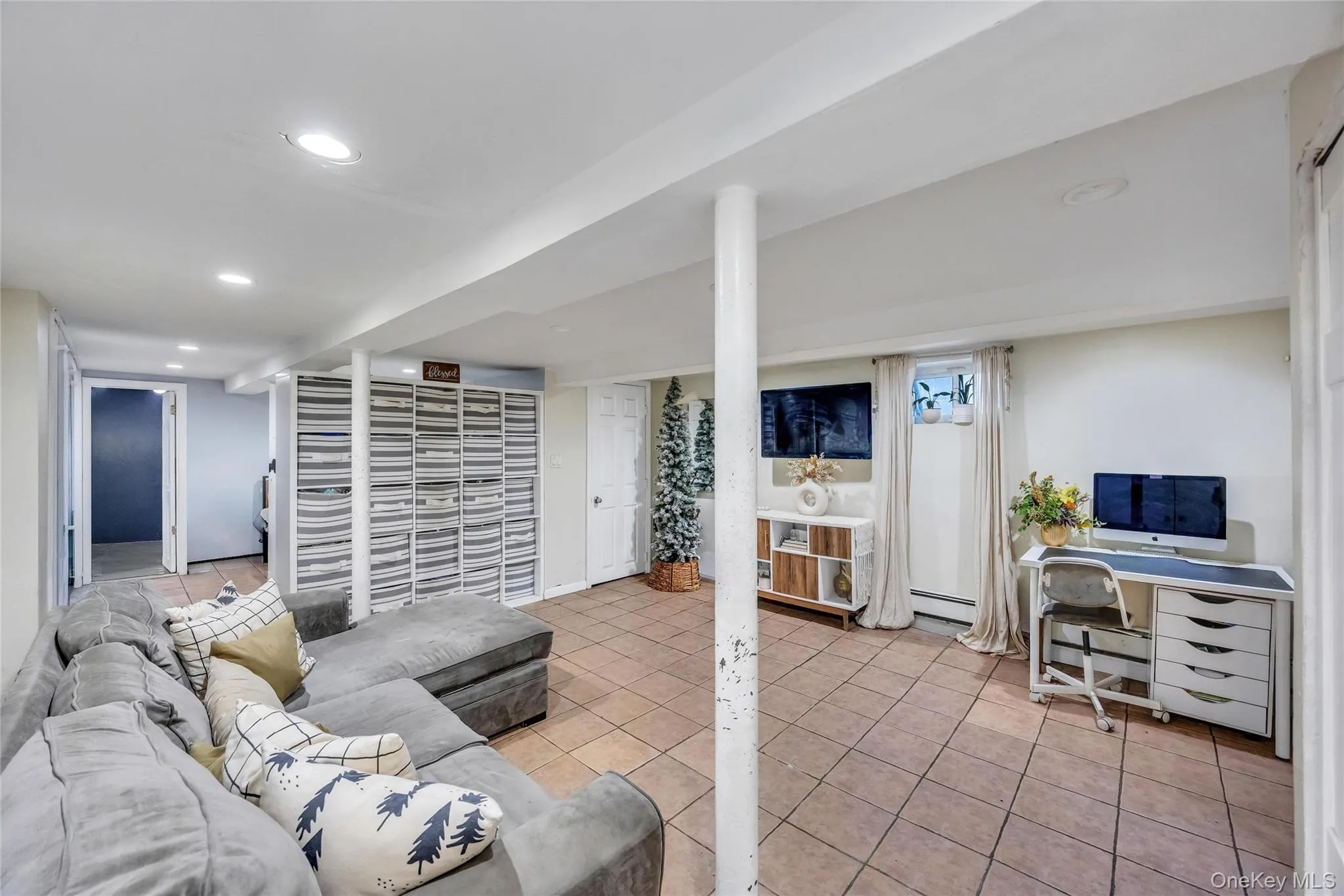 Finished basement with recessed lighting and tile flooring Finished basement with recessed lighting and tile flooring