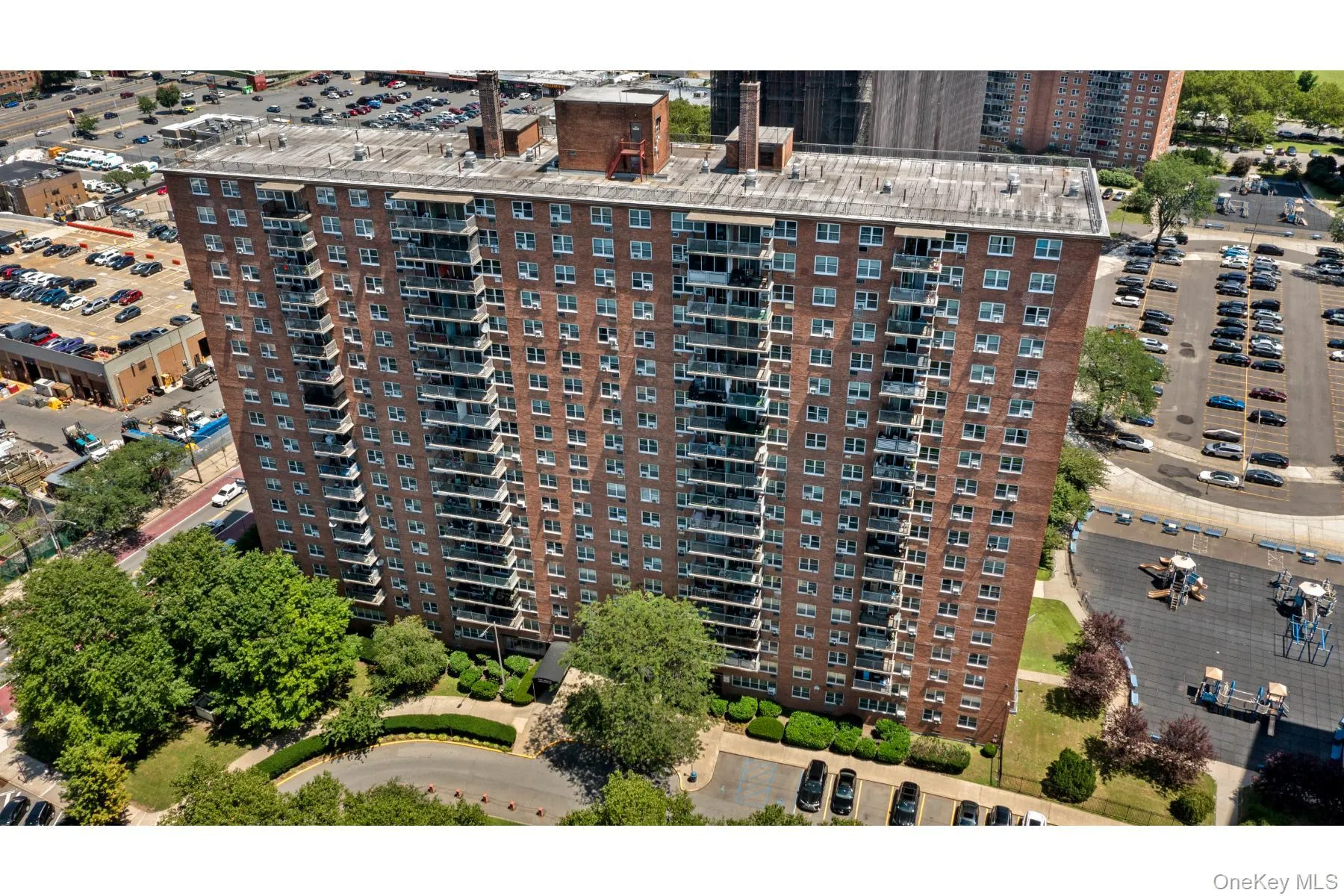High-rise building with brick facade and multiple balconies High-rise building with brick facade and multiple balconies