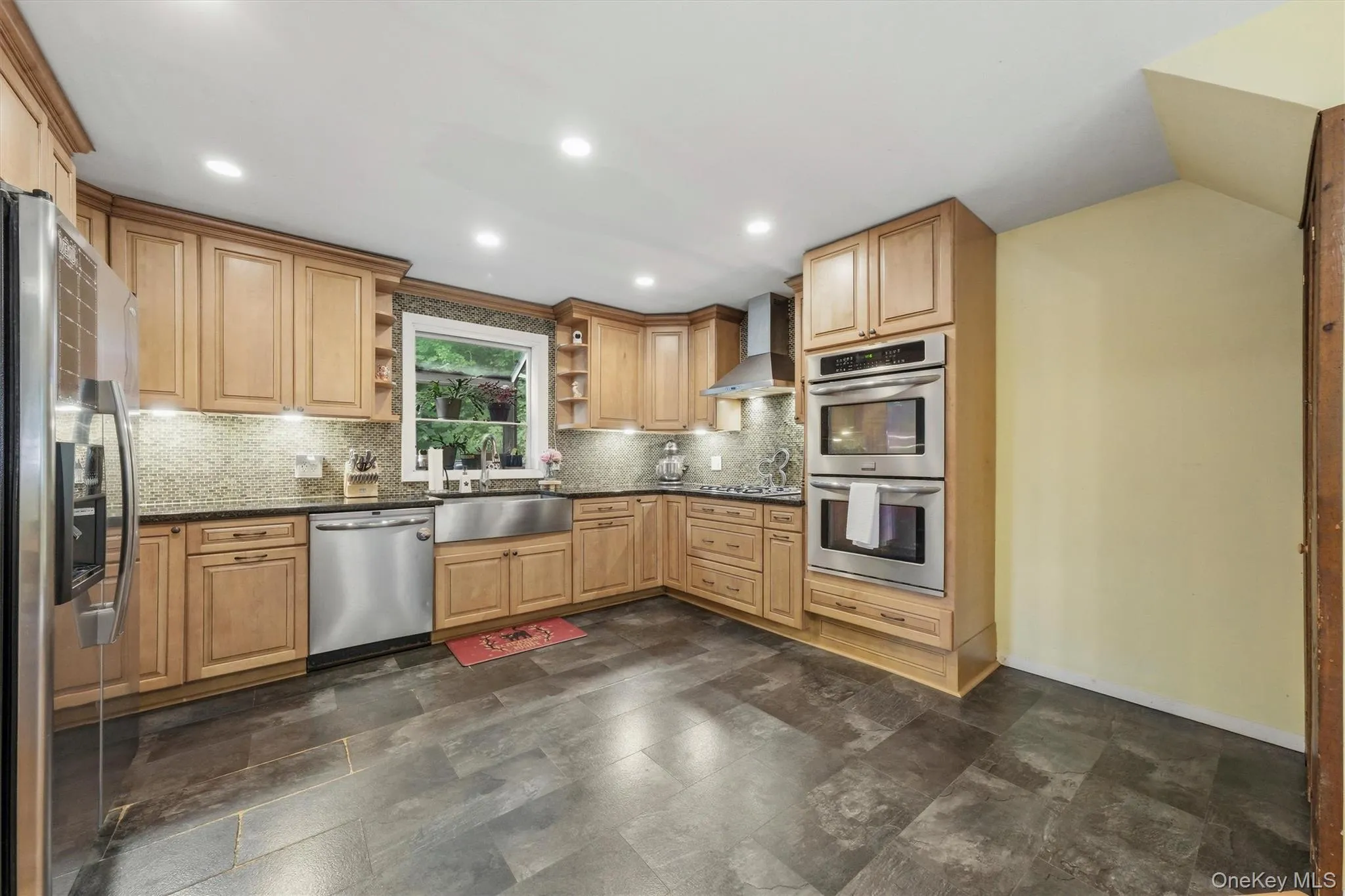 Updated custom kitchen features CraftMaid cabinets, Double oven, range top and tile flooring Updated custom kitchen features CraftMaid cabinets, Double oven, range top and tile flooring