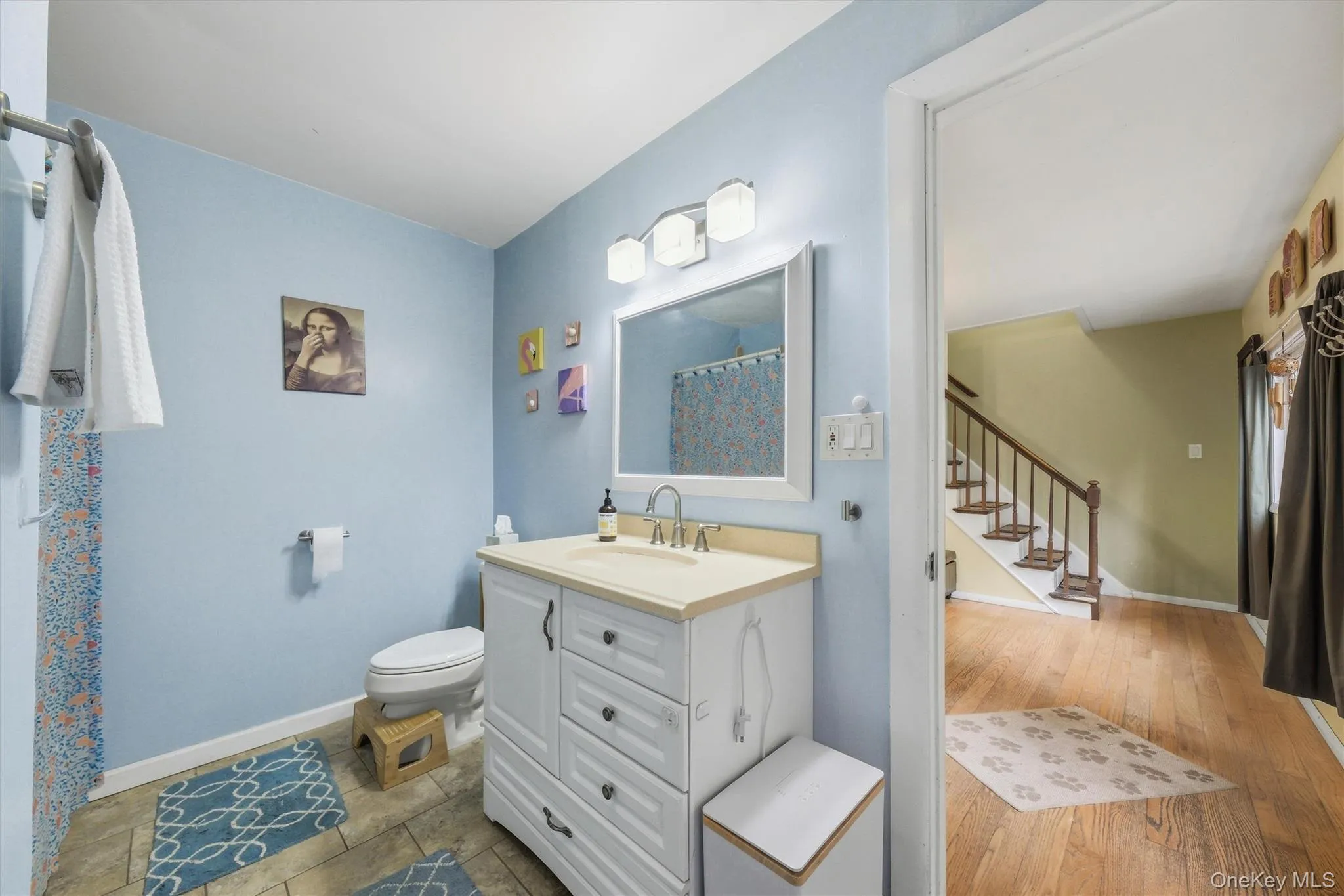Clean and bright, tiled with an oversized vanity. Clean and bright, tiled with an oversized vanity.