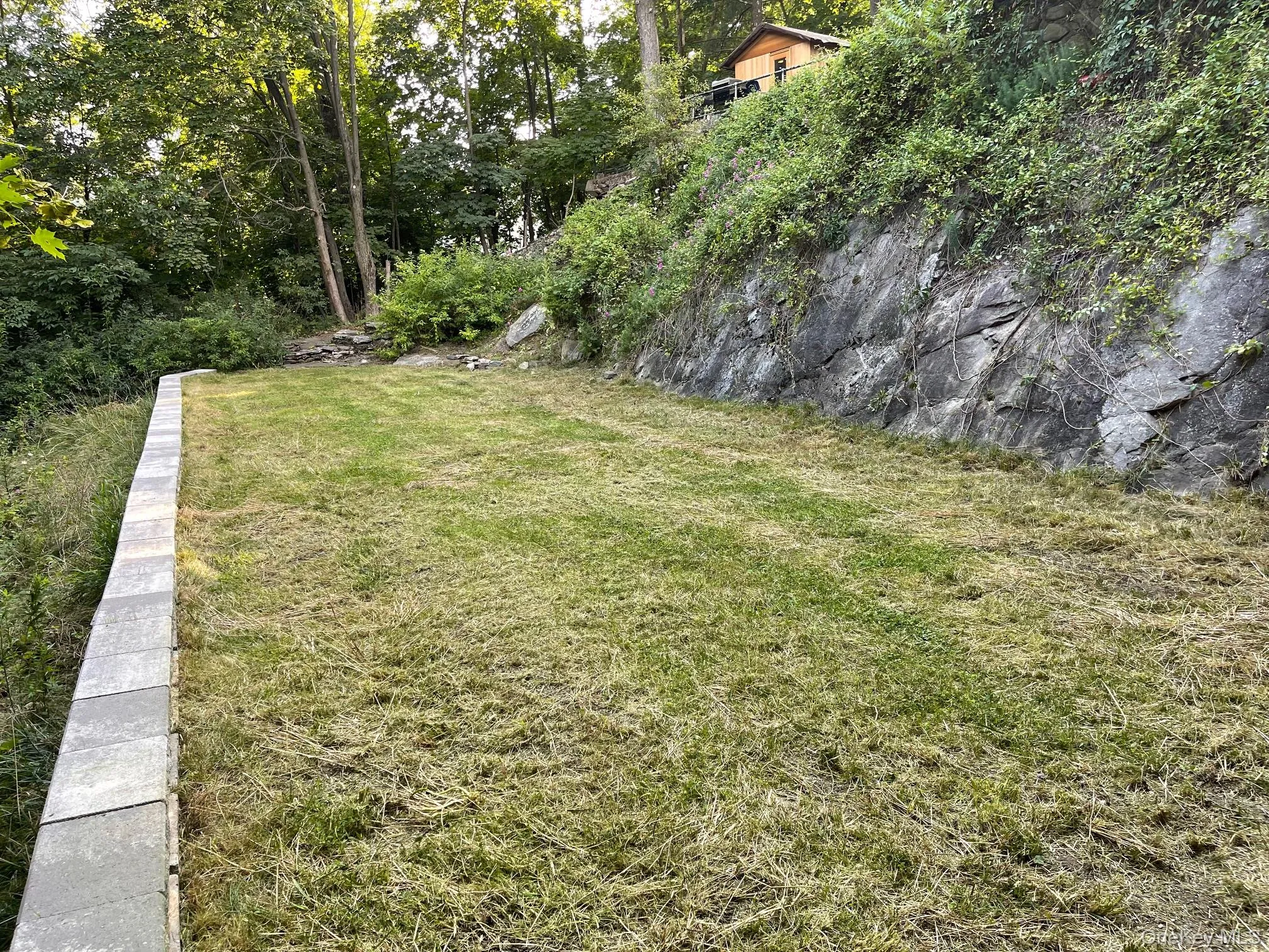 Expansive, flat lower lawn Expansive, flat lower lawn