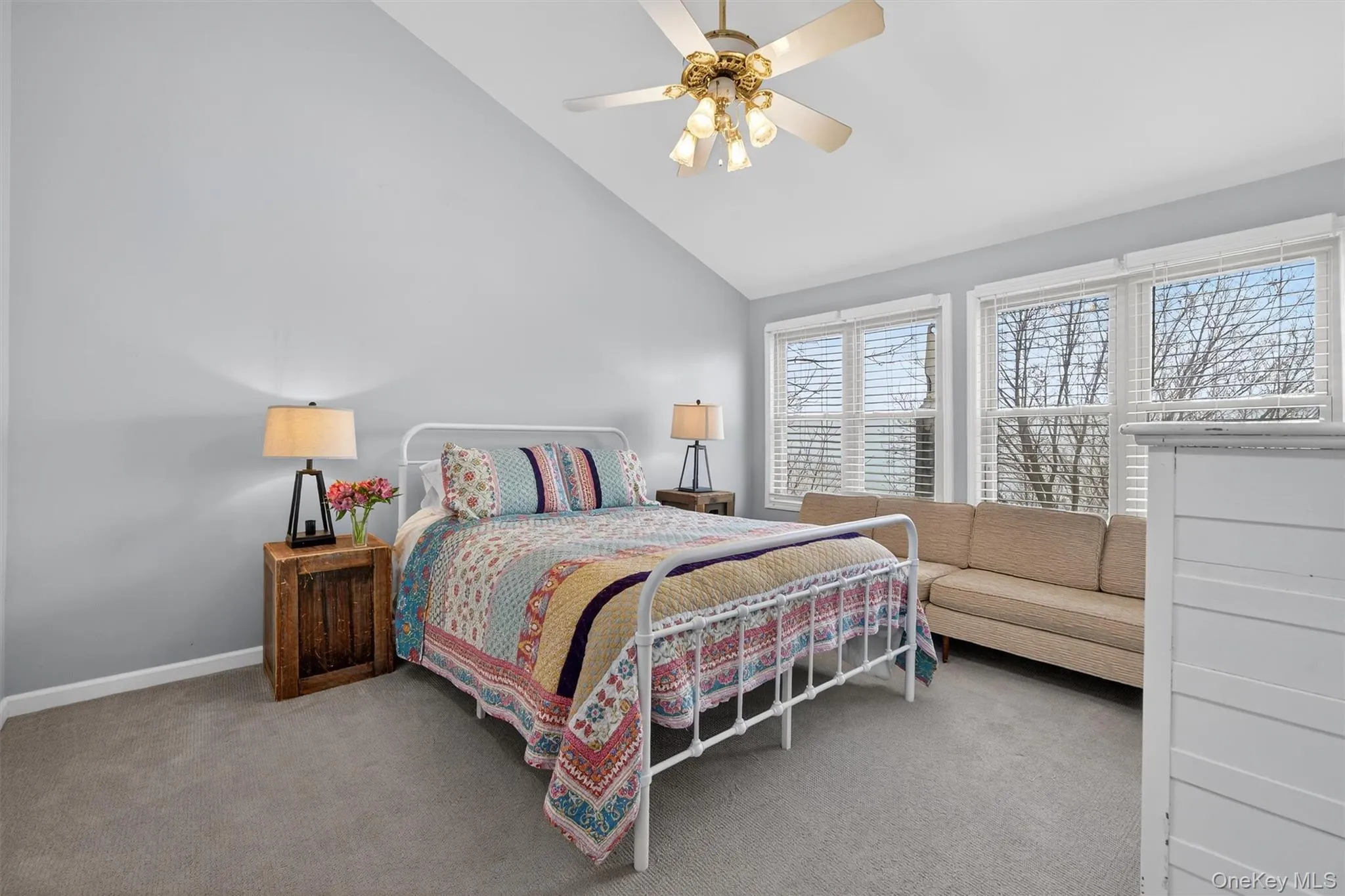Spacious primary bedroom with sweeping views and double closets. Spacious primary bedroom with sweeping views and double closets.