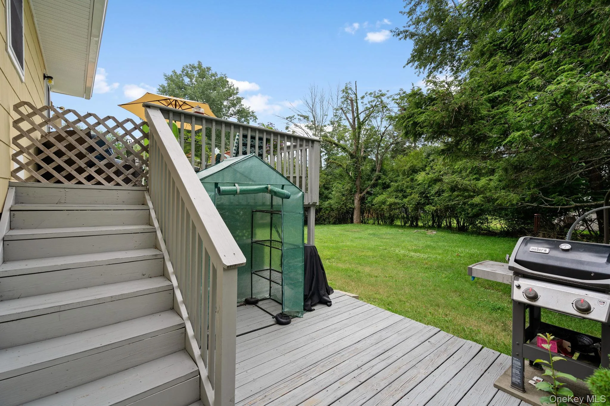 Rear deck leading to the private yard space. Rear deck leading to the private yard space.