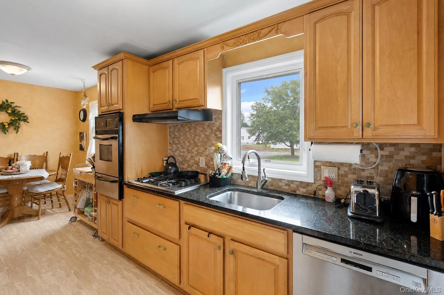 Kitchen provides wall oven, gas cooktop, and Bosch dishwasher. Kitchen provides wall oven, gas cooktop, and Bosch dishwasher.
