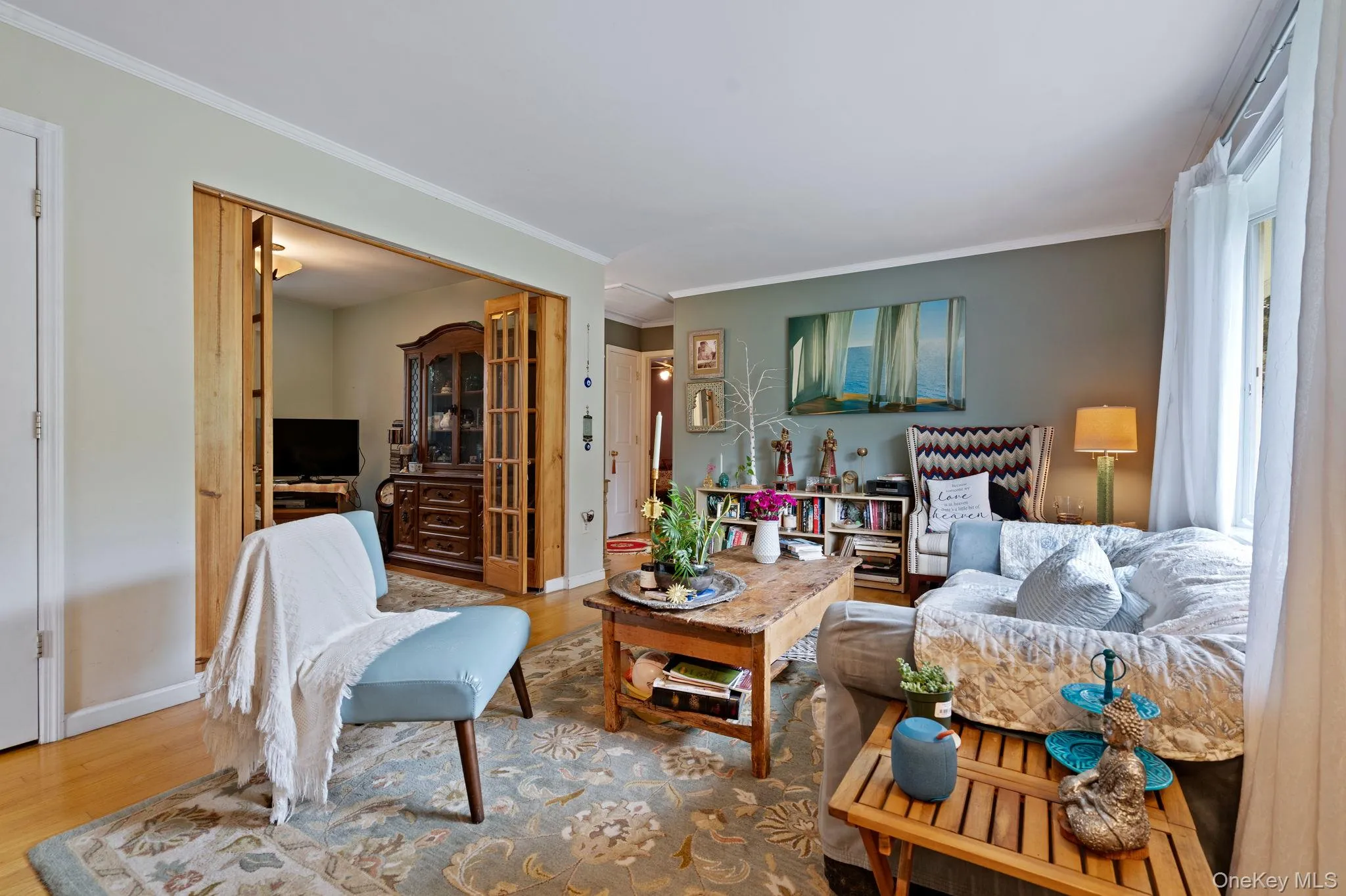 Sundrenched living room with hardwood flooring. Sundrenched living room with hardwood flooring.